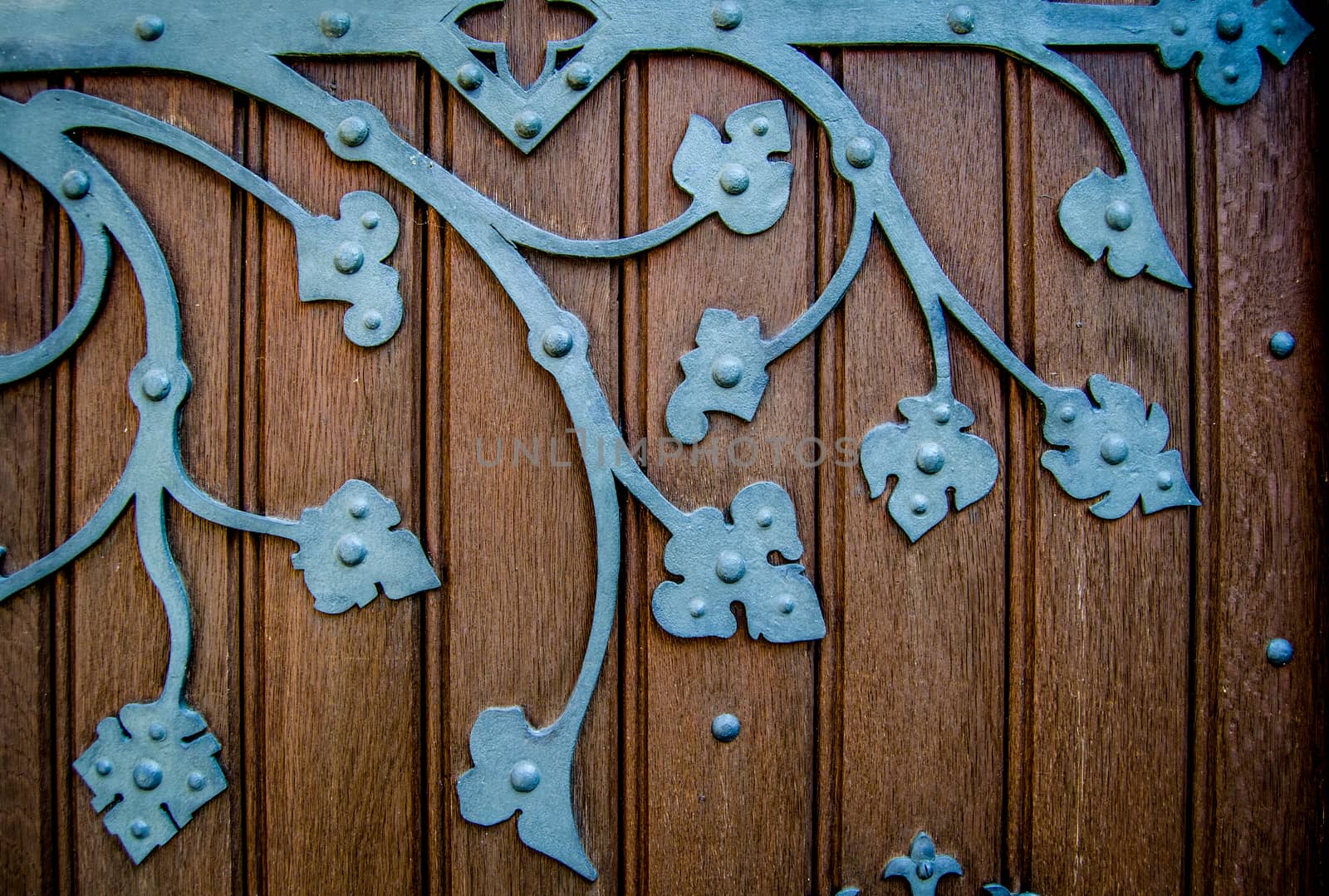 Detail Of An Ornate HInge On An Old Church Door