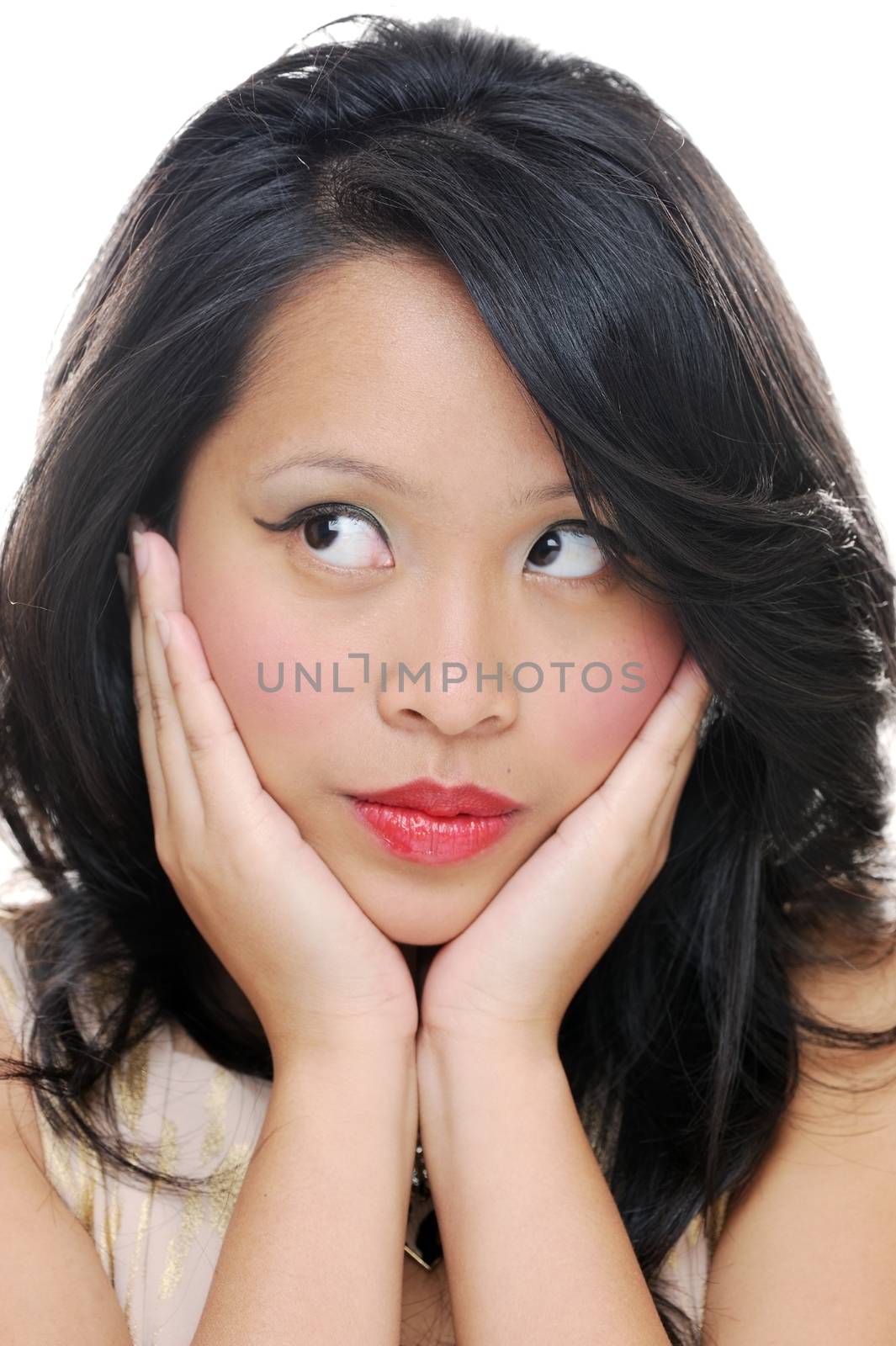 Asian female's face with makeup looking sideways