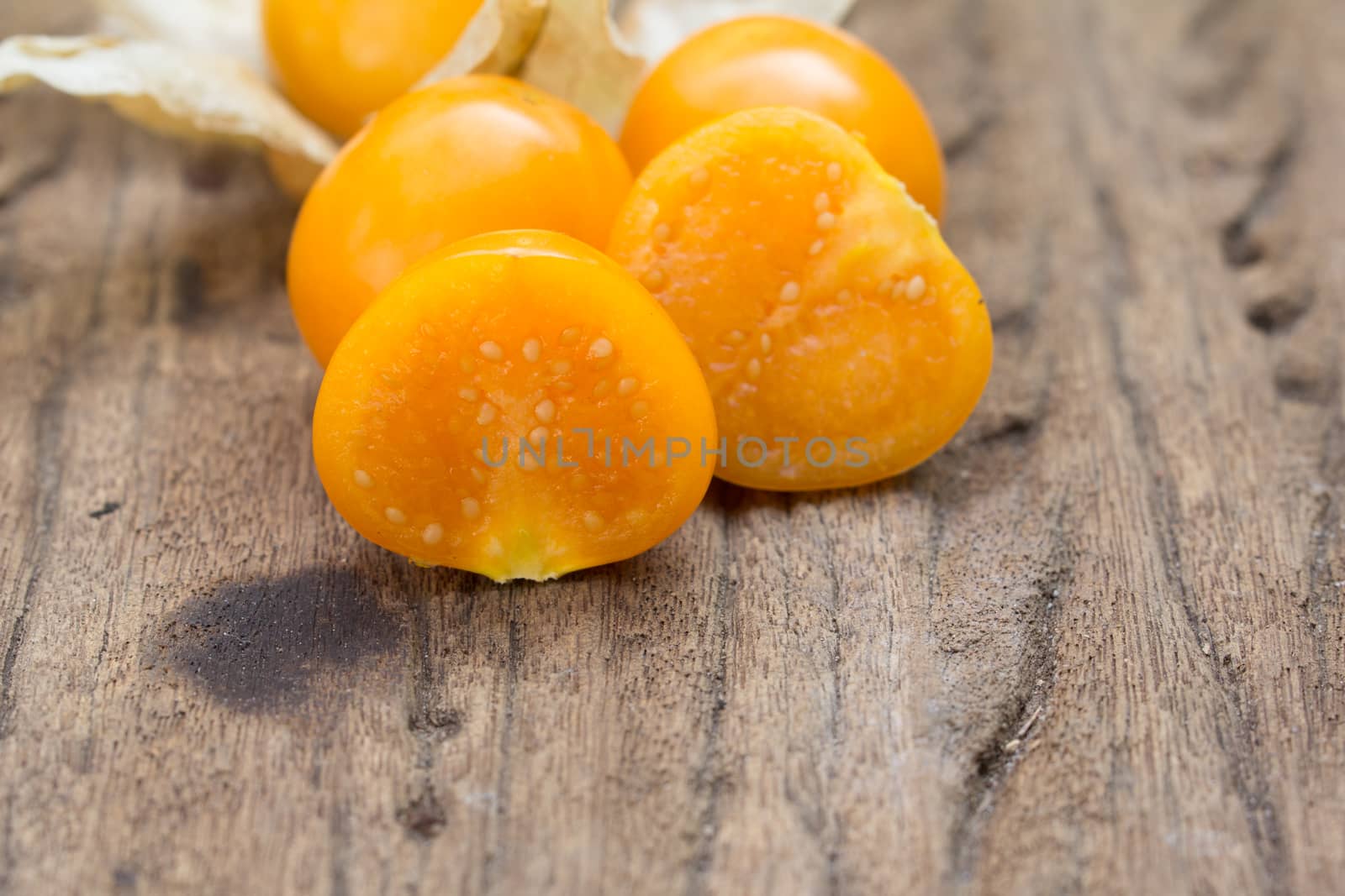 Cape gooseberry, physalis on wood background.