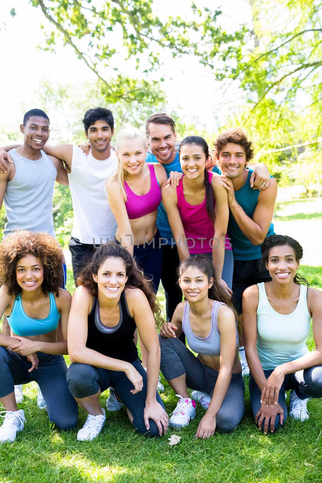 Group portrait of multiethnic friends in sportswear at the park