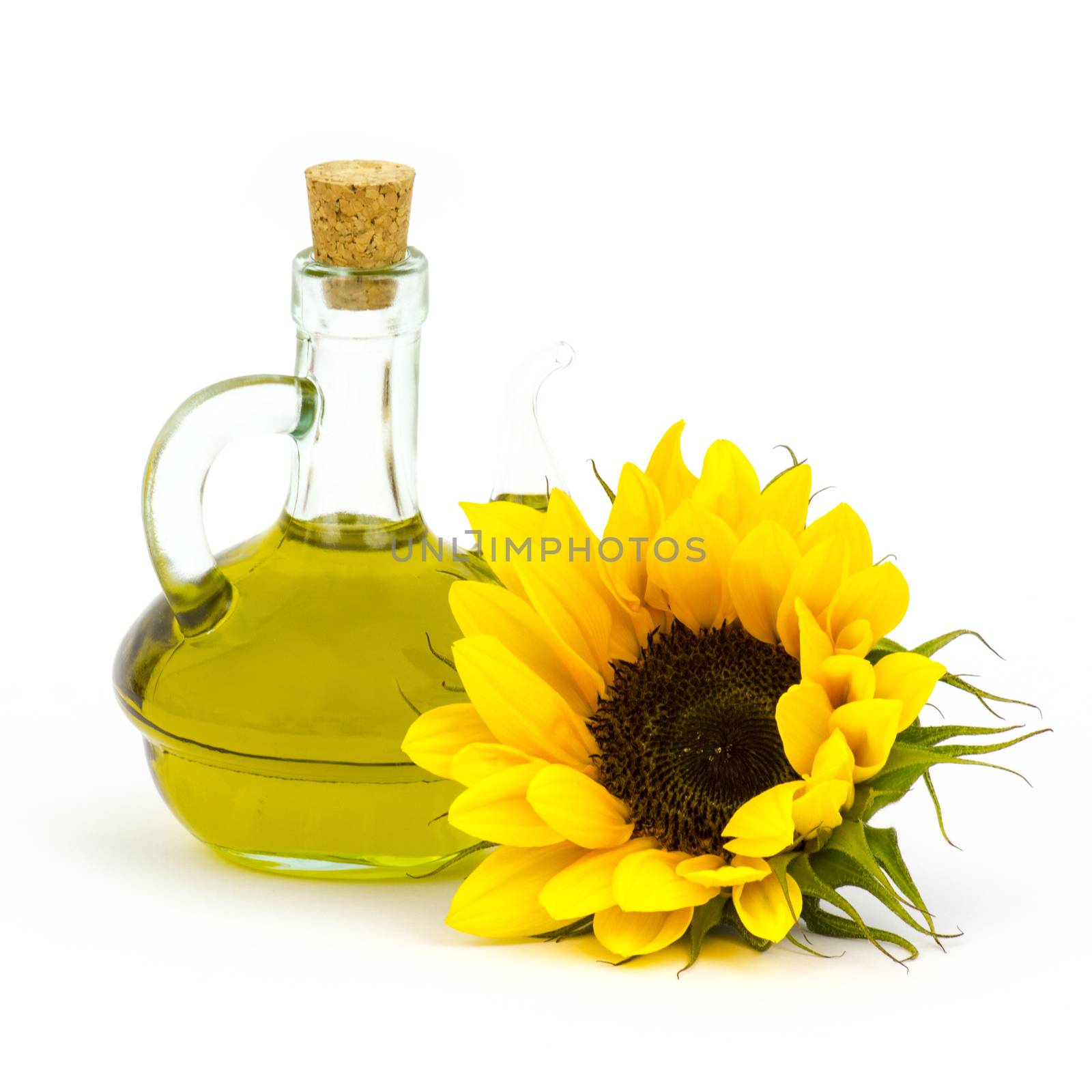 sunflower oil and sunflowers isolated on white background