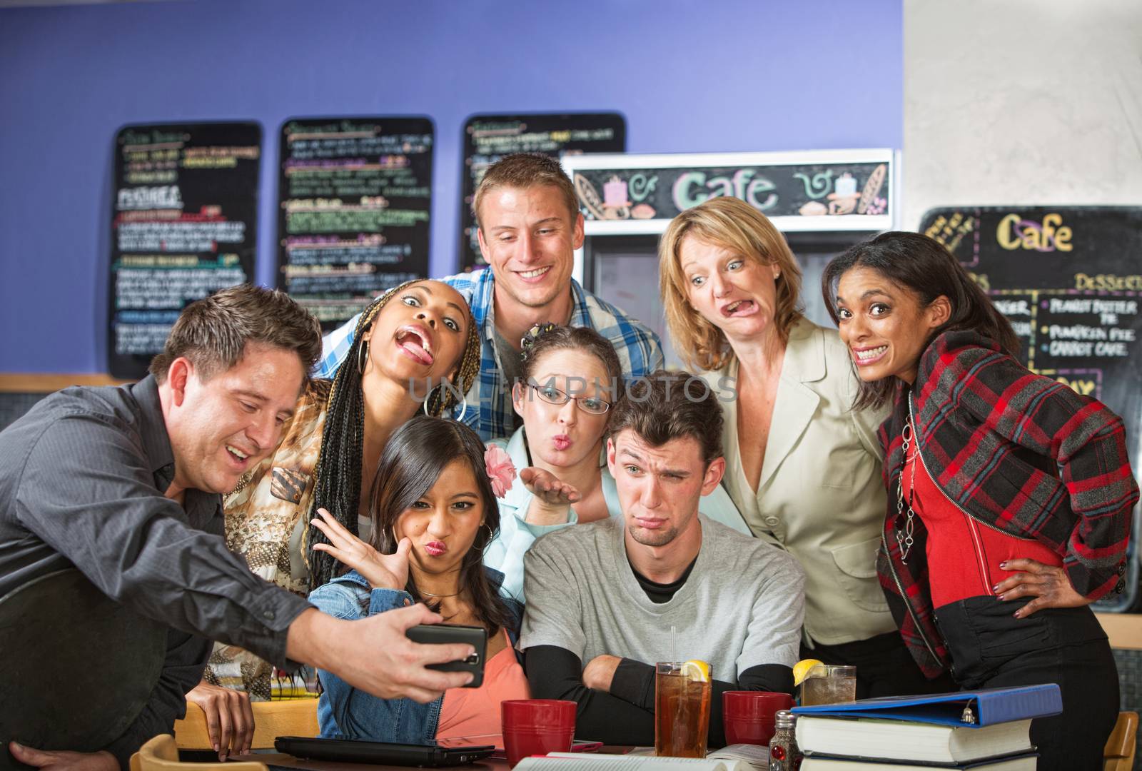 Students making faces for barista taking pictures