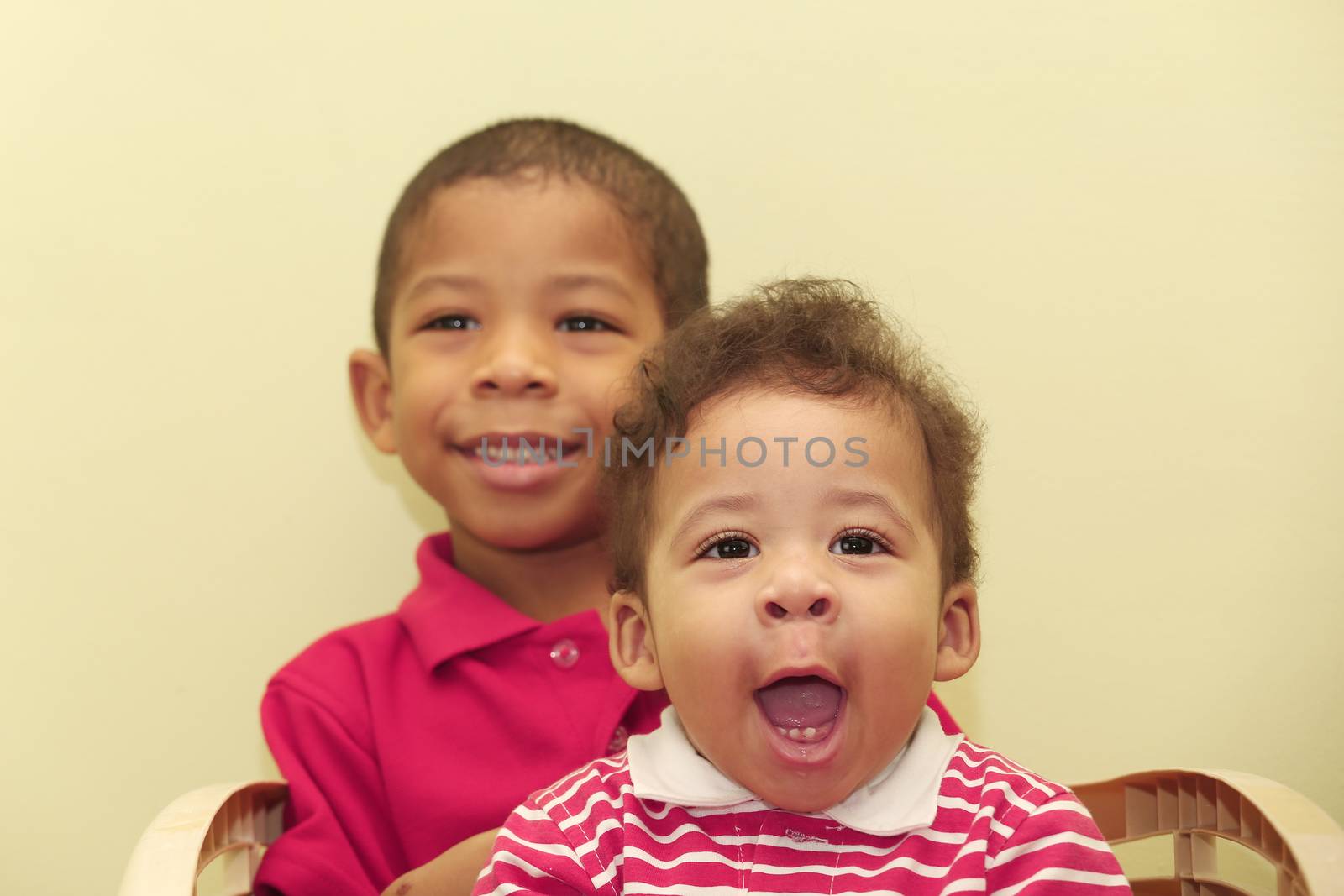 Portrait of two african brothers. Focus in the front kid.