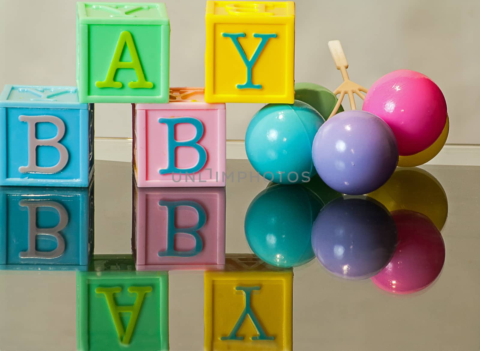 Baby in Blocks with plastic balloons
