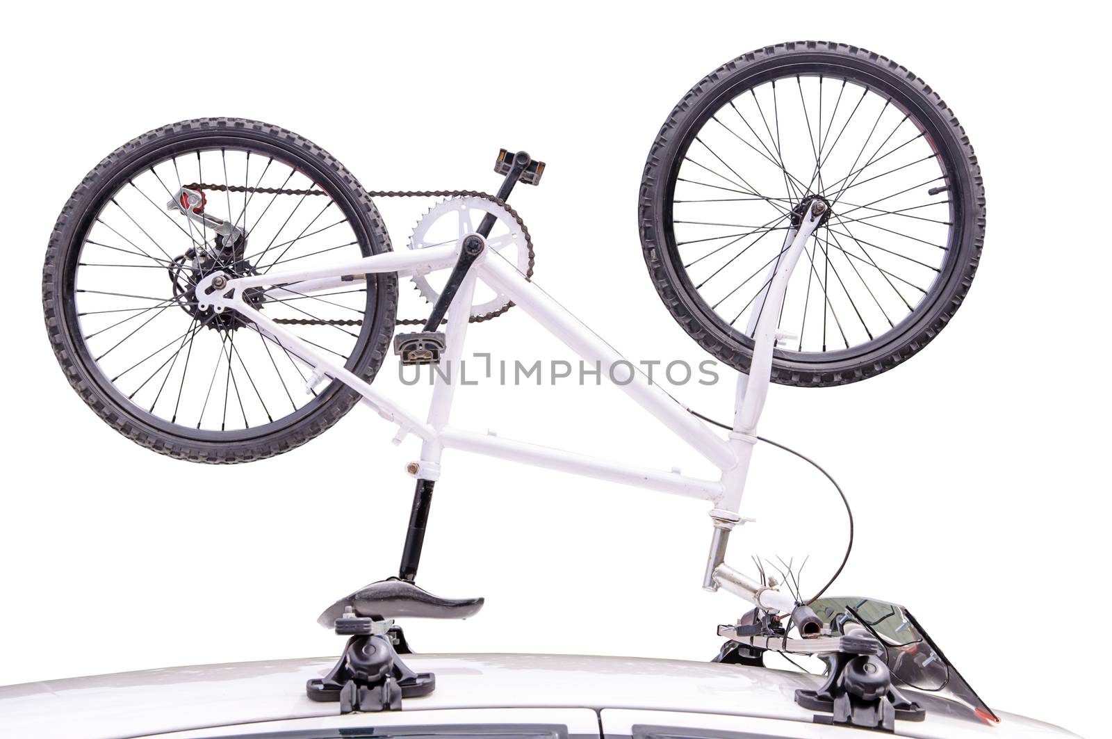 Bicycle on the roof of the car. isolated on white