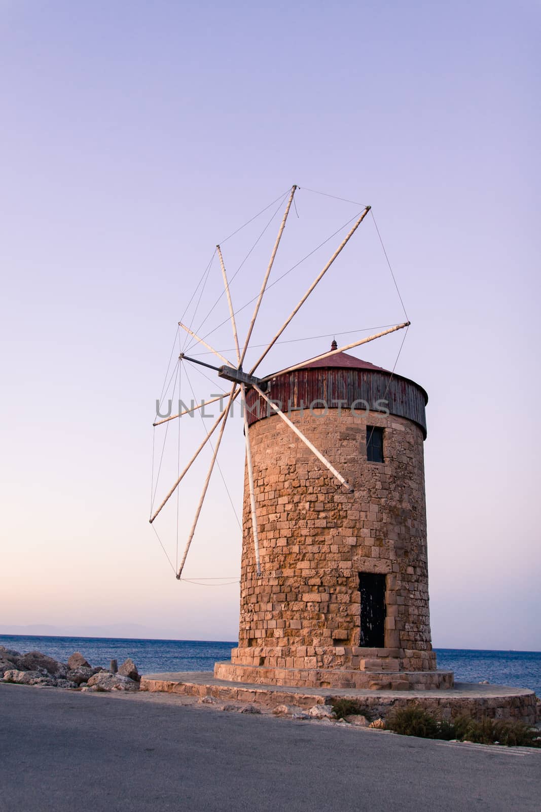 Windmill In Mandraki Port by claraveritas