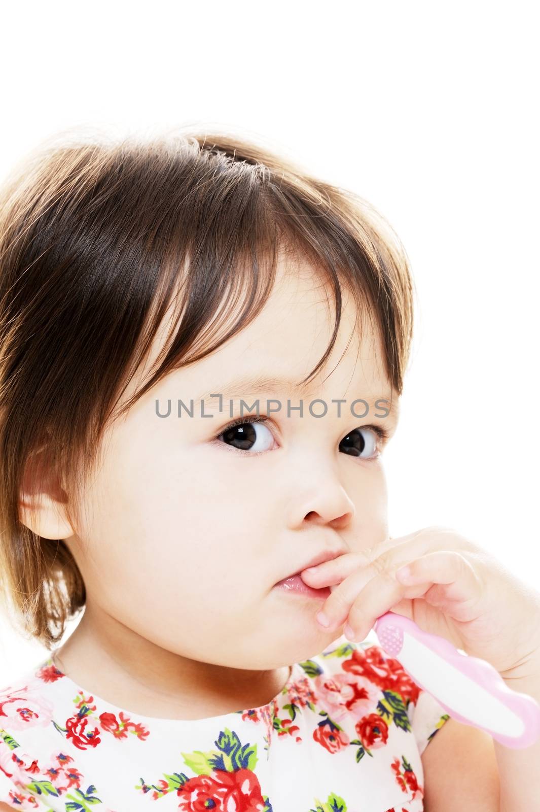 Young girl brushing teeth closeup portrait