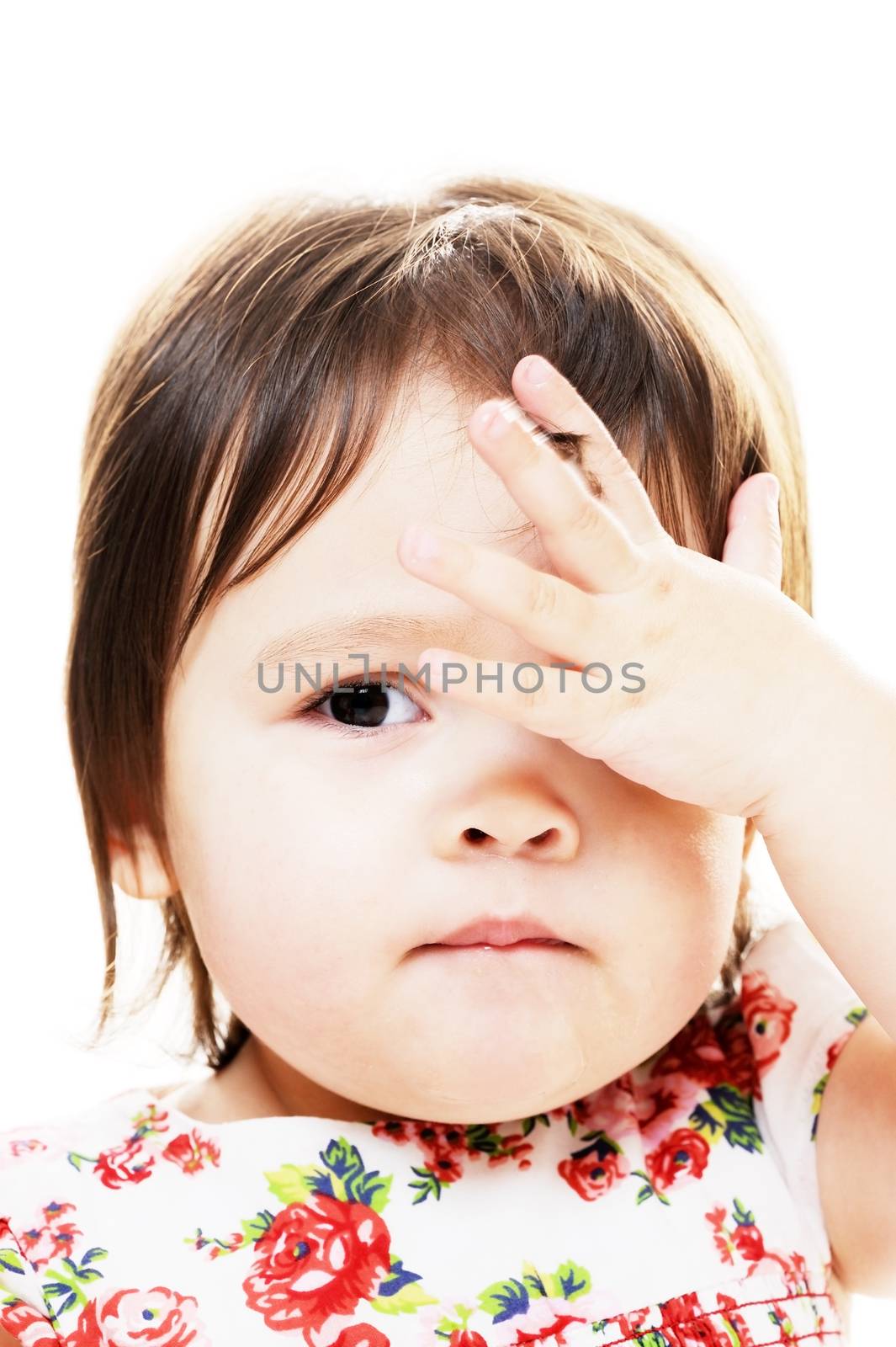 Infant girl looks like she did big mistake closeup portrait