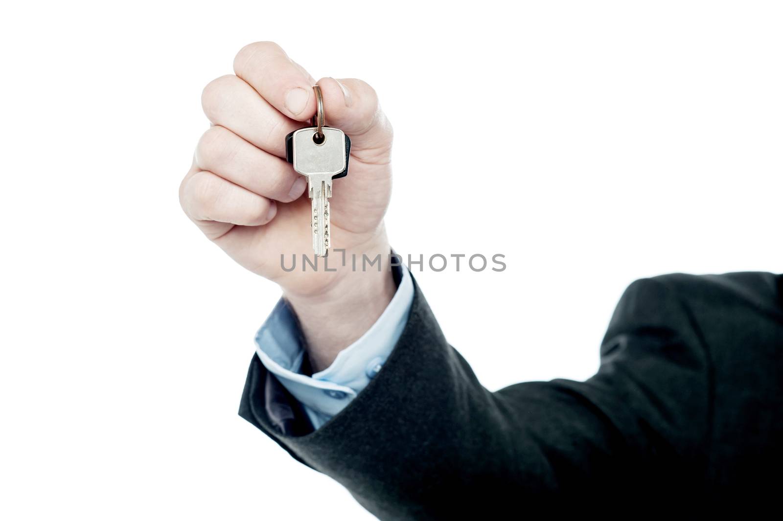Male hand giving your key, isolated on white by stockyimages