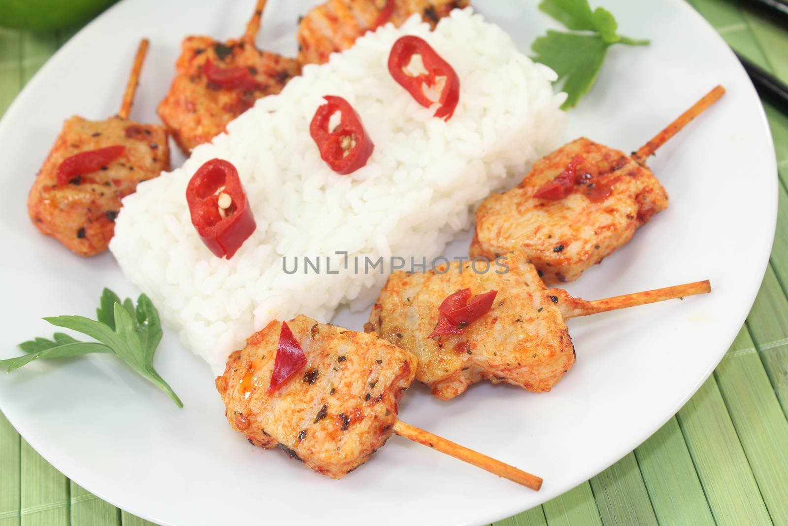 Asian sate skewers with rice, chili and peanut sauce