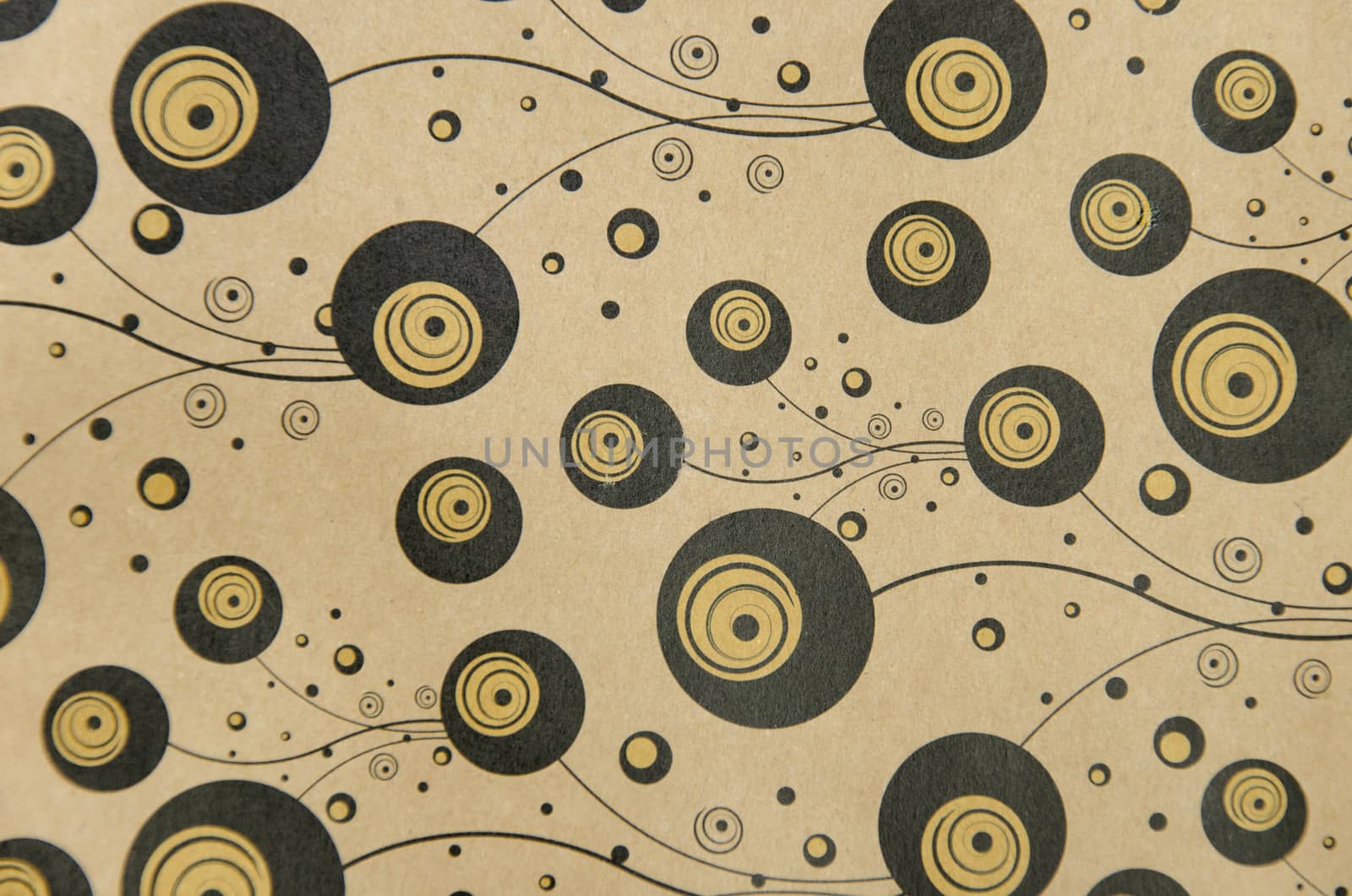 background of paper ornamented with black gold bubbles curled strips points
