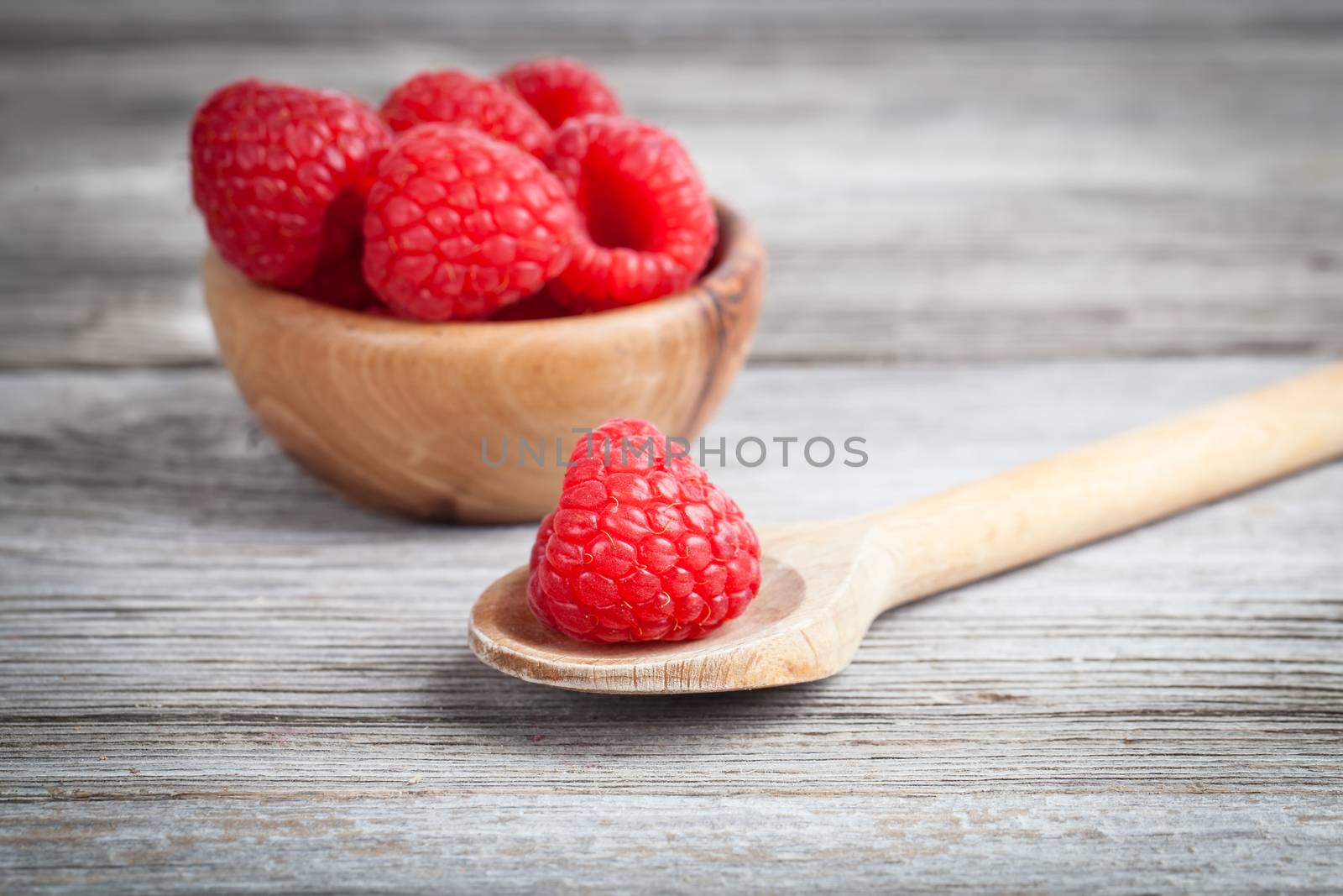 raspberries on wooden table