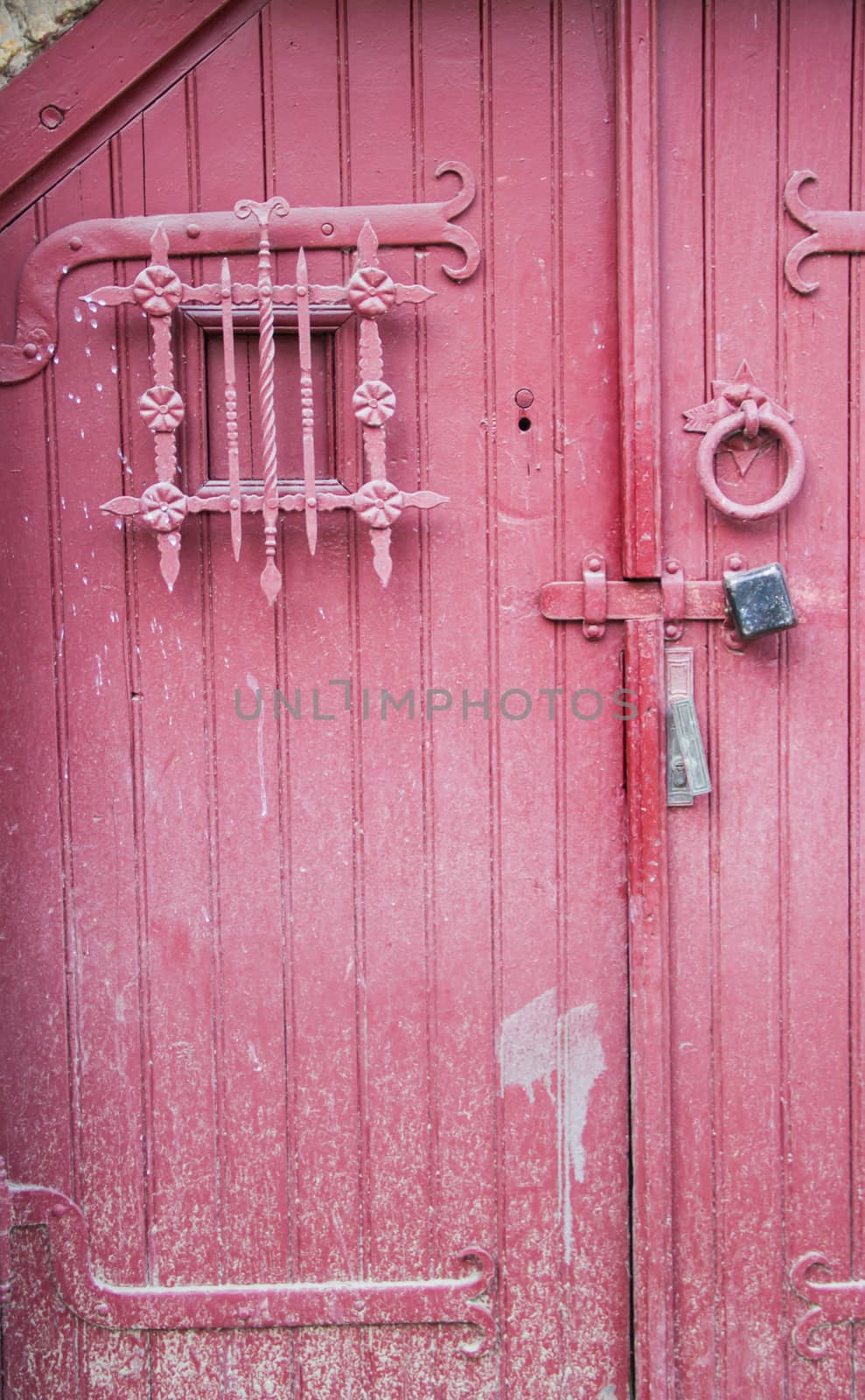old red door in small old town