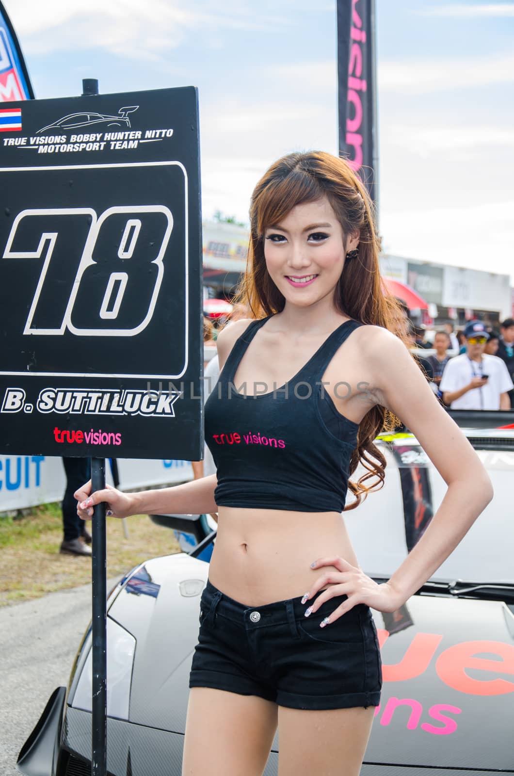 CHON BURI - JULY 5: Unidentified model with racing car on display at the Thailand Super Series 2014 Race 3 on July 5, 2014 at the Bira International Circuit Pattaya, Chon Buri Thailand.