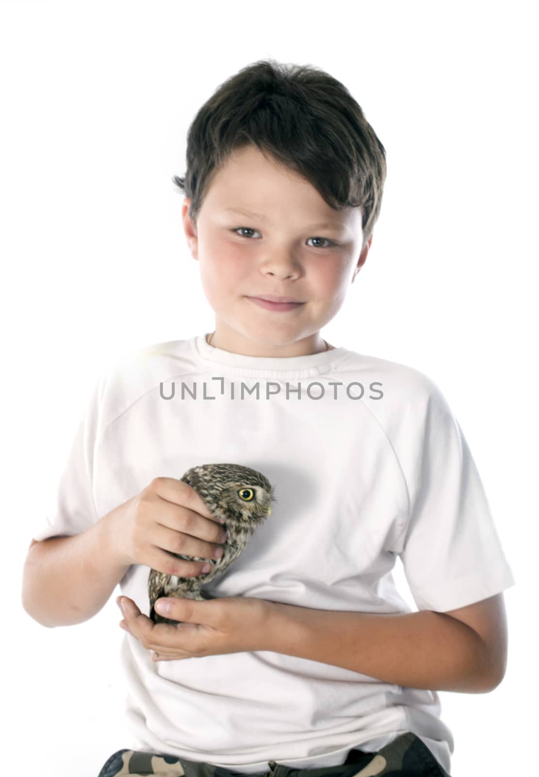 Little owl and child in front of white background