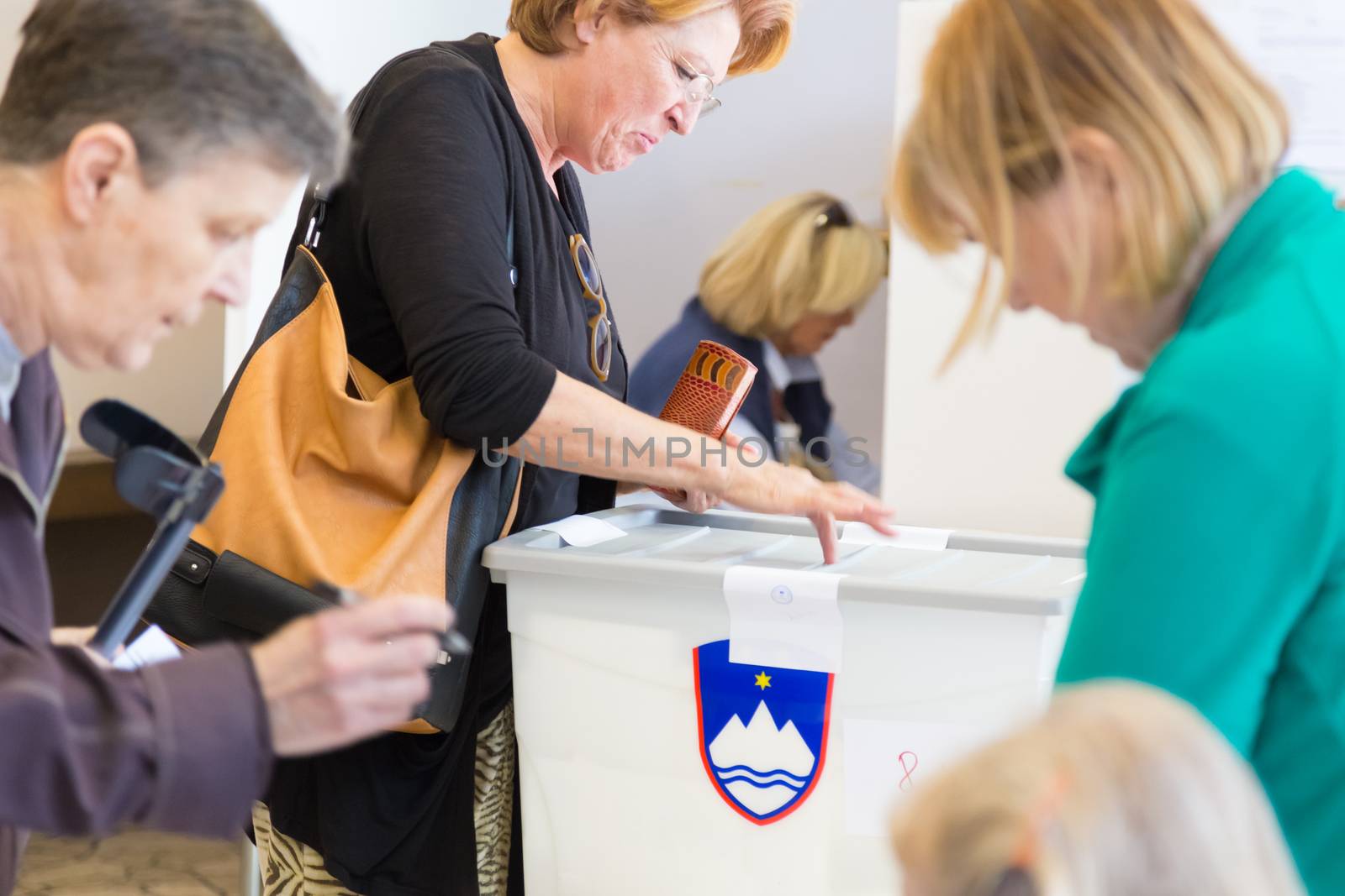 LJUBLJANA, SLOVENIA - JULY 13: People voting on parliamentary election for the 90 deputies to the National Assembly of Slovenia on June 13th, 2014, Ljubljana, Slovenia, EU.