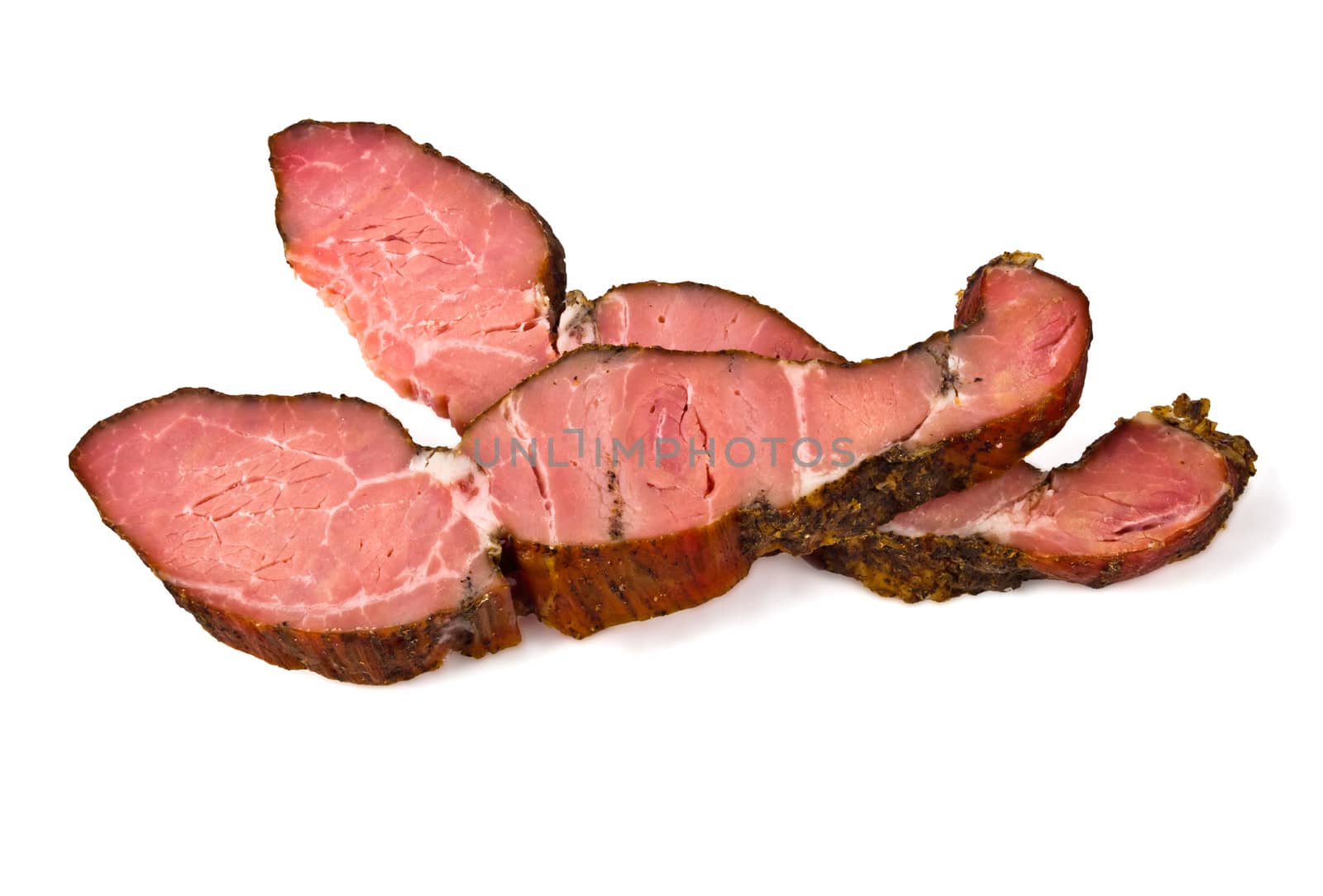 Two pieces of smoked meat on a white background