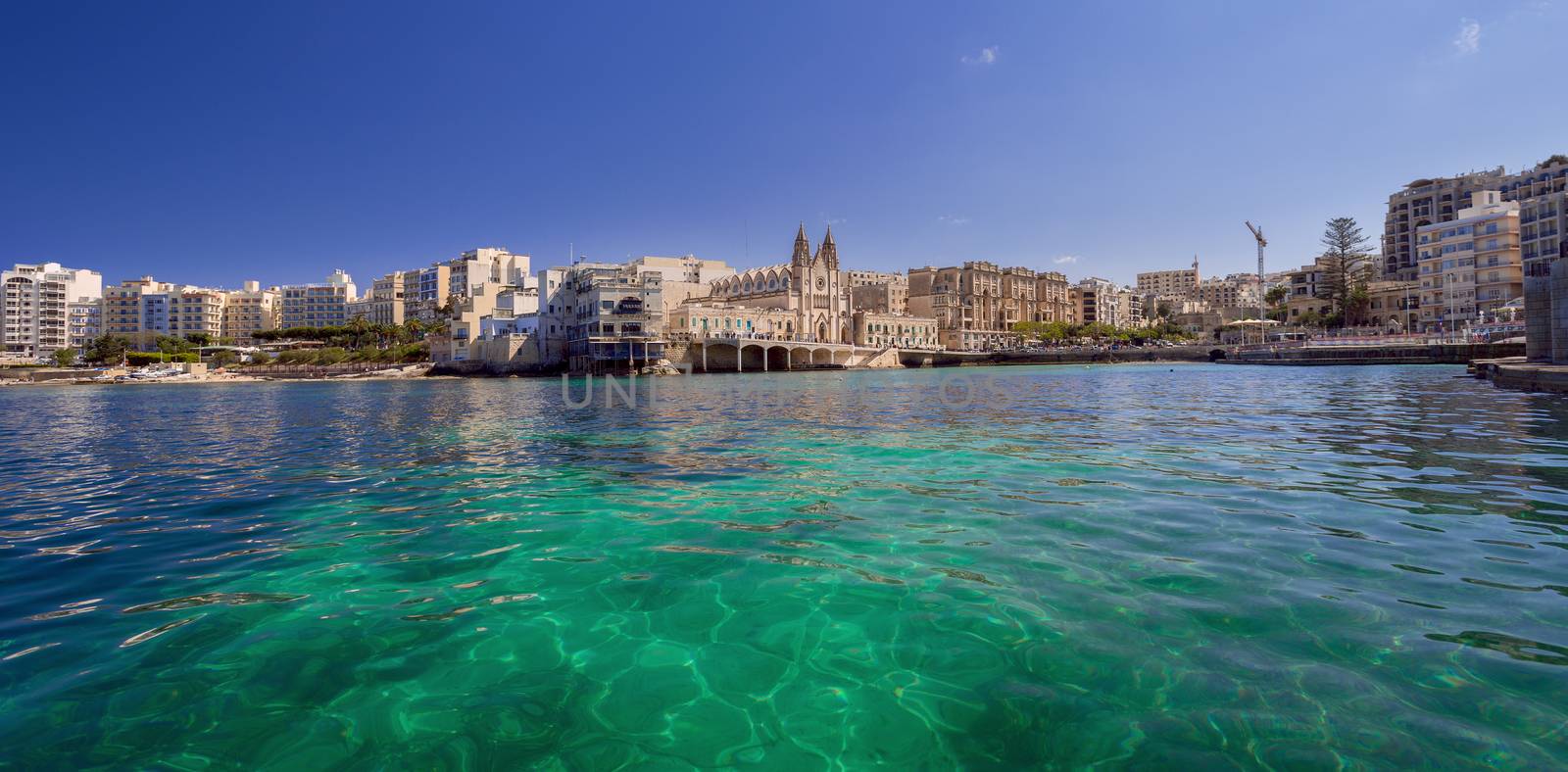 Neo-gothic Carmelite Parish Church and Balluta Buildings in Balluta Bay, St Julian's, Malta