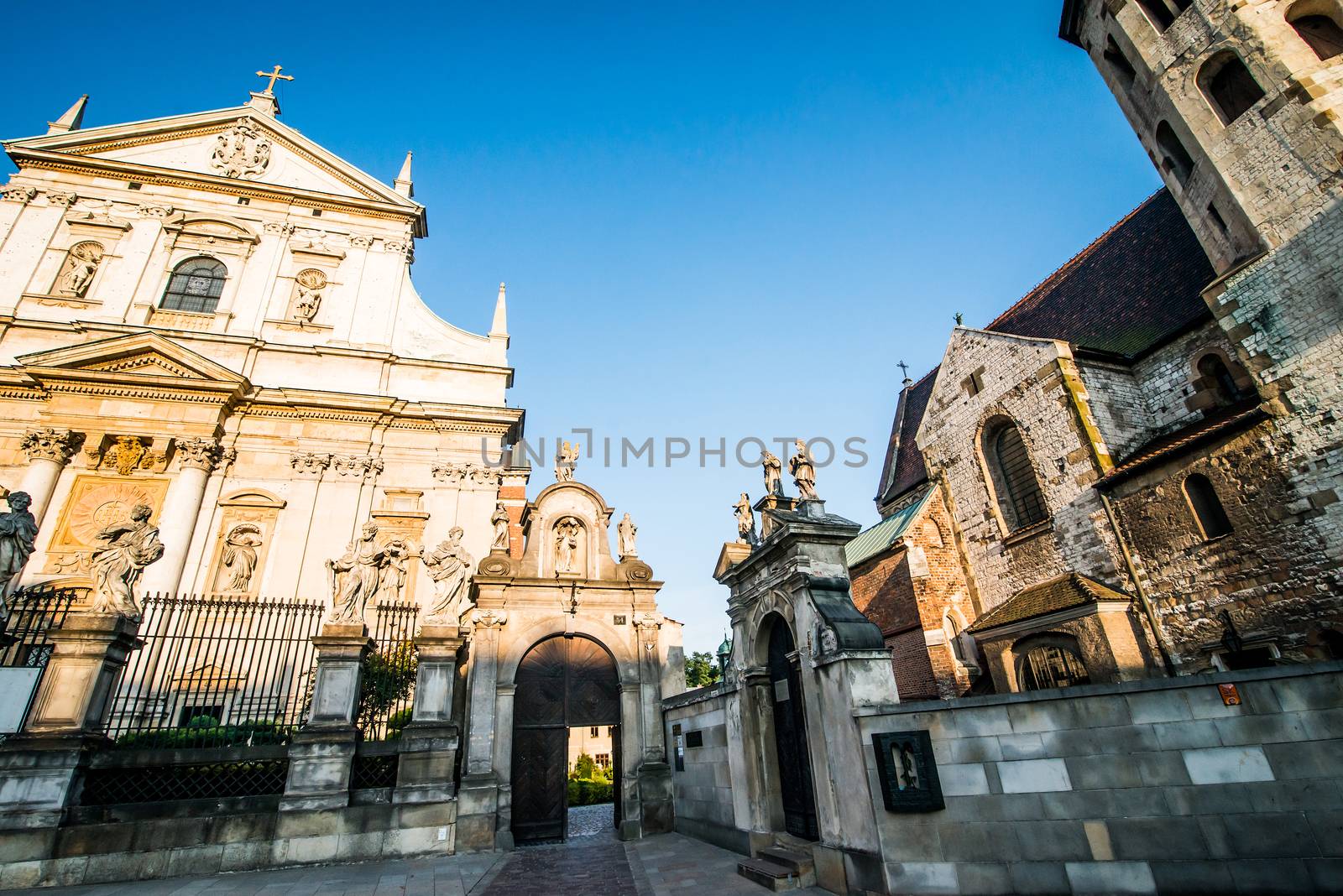 KRAKOW, POLAND - AUGUST 24: Baroque Church of St. Peter and St. Paul and the statues of the twelve apostles on Grodzka in the city of Krakow in Poland on 24 august 2013. Dates from 1596.