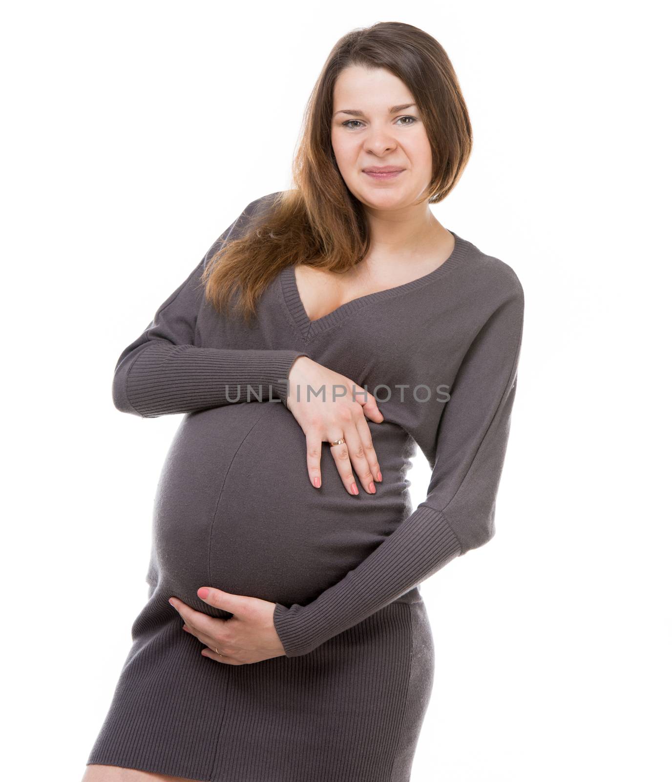 young pregnant girl hugging her belly and looking into camera isolated on white background