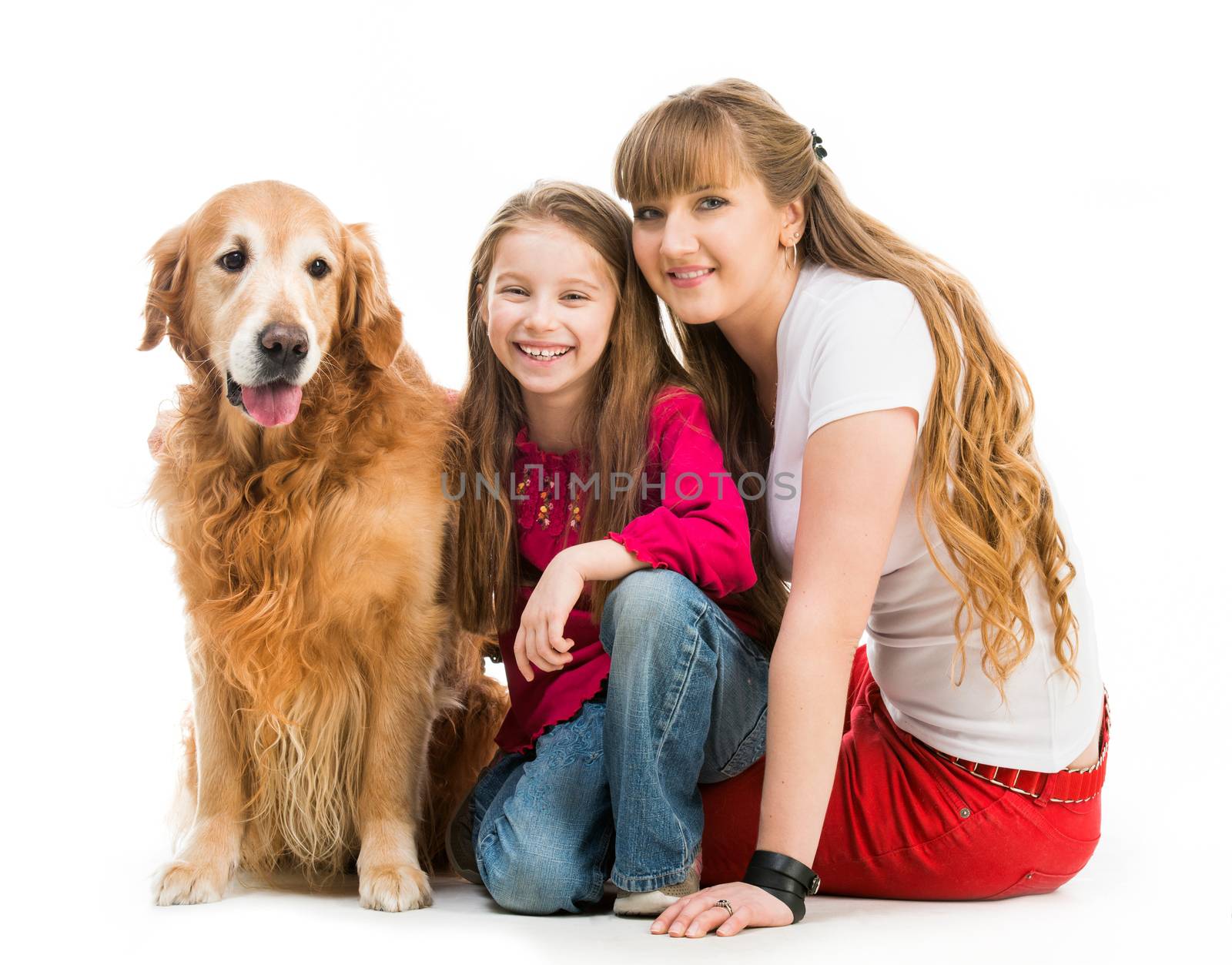 smiling woman and little girl with a red retriever on white background