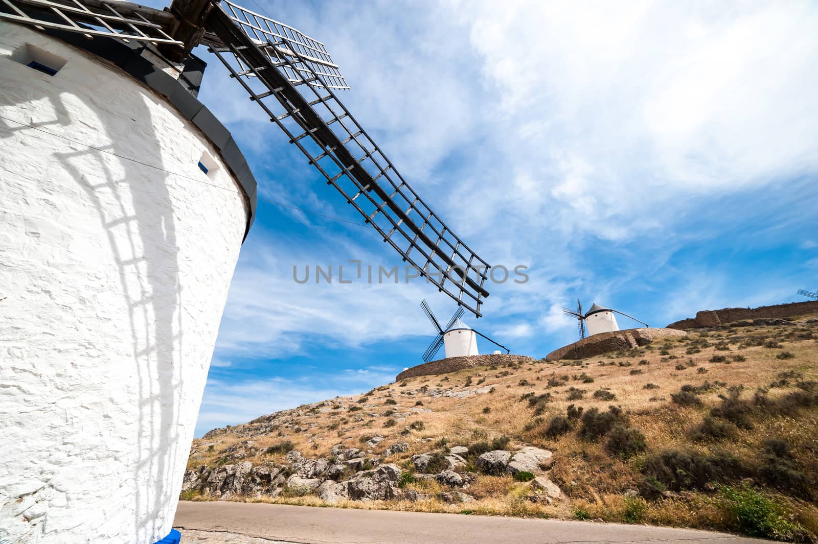 traditional windmills and castle in Consuegra, Toledo, Spain