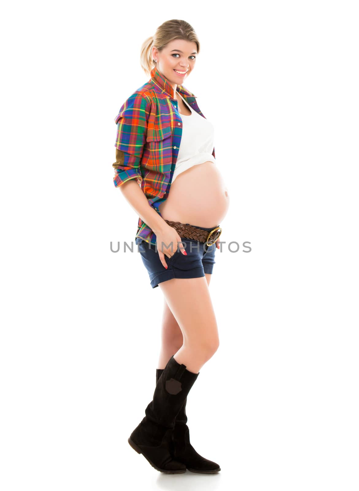 Beautiful pregnant white woman wearing shirt isolated in studio