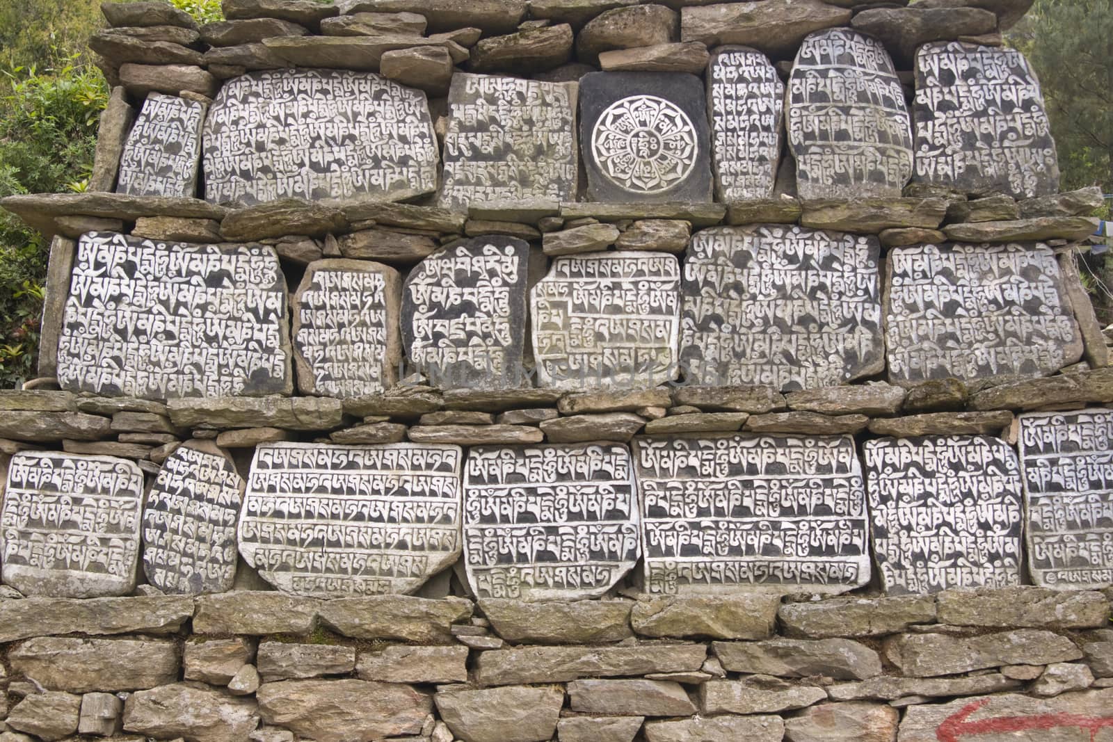 Buddhist Mani stones along the trekking route to Everest Base camp in Nepal