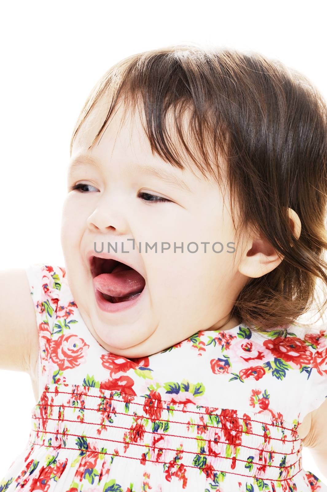 Little girl with mouth open showing tongue