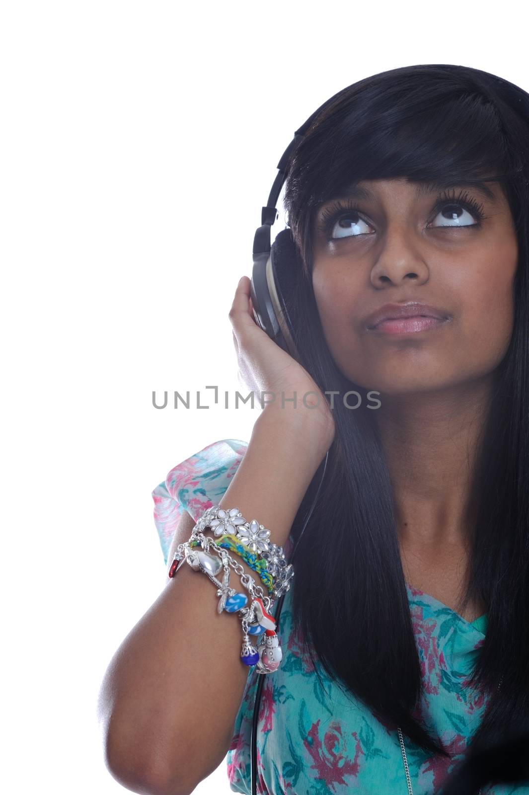 Teen girl from india listens to music