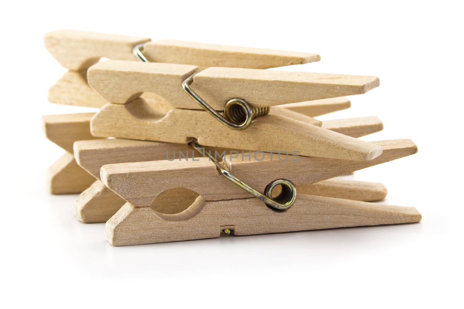 wooden clothes pegs isolated on white background