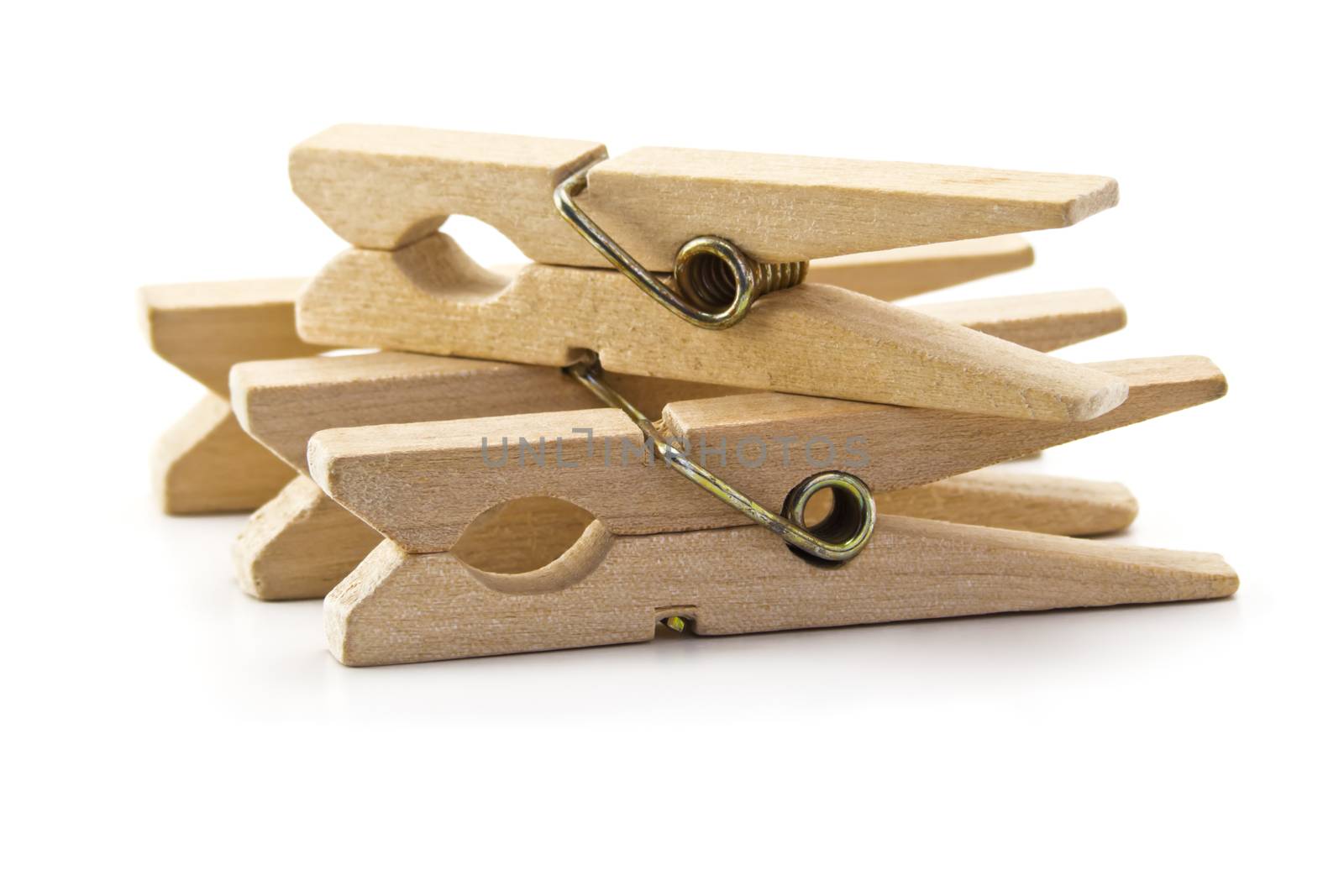 wooden clothes pegs isolated on white background