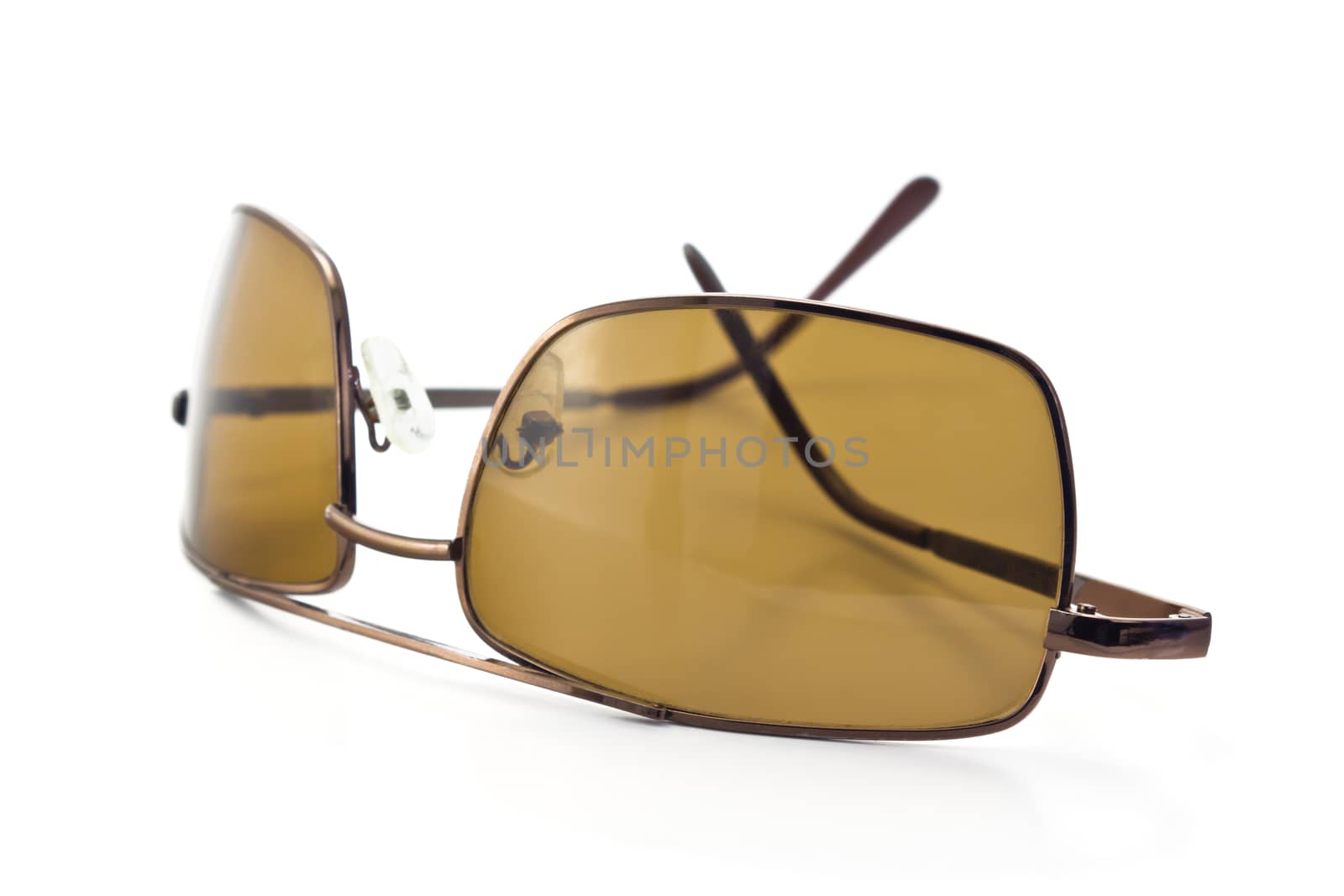 brown sunglasses to protect from the sun, isolated on white background