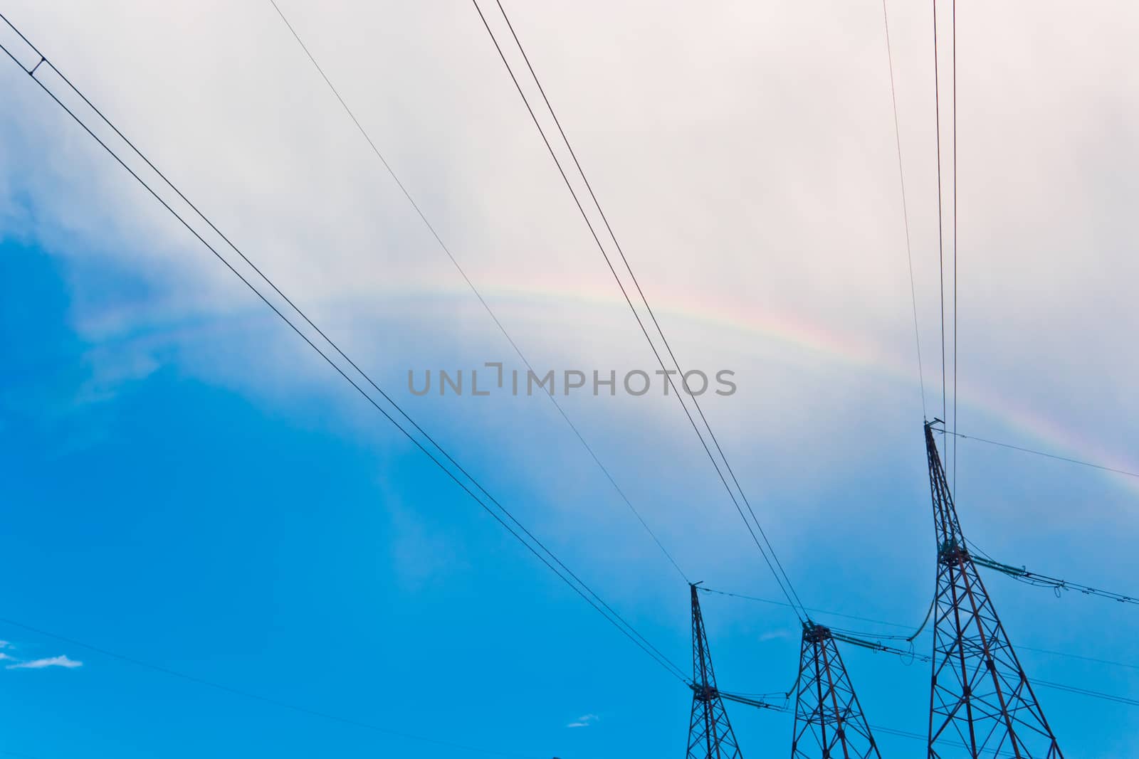 power line pylon, cable background with rainbow, sky, clouds