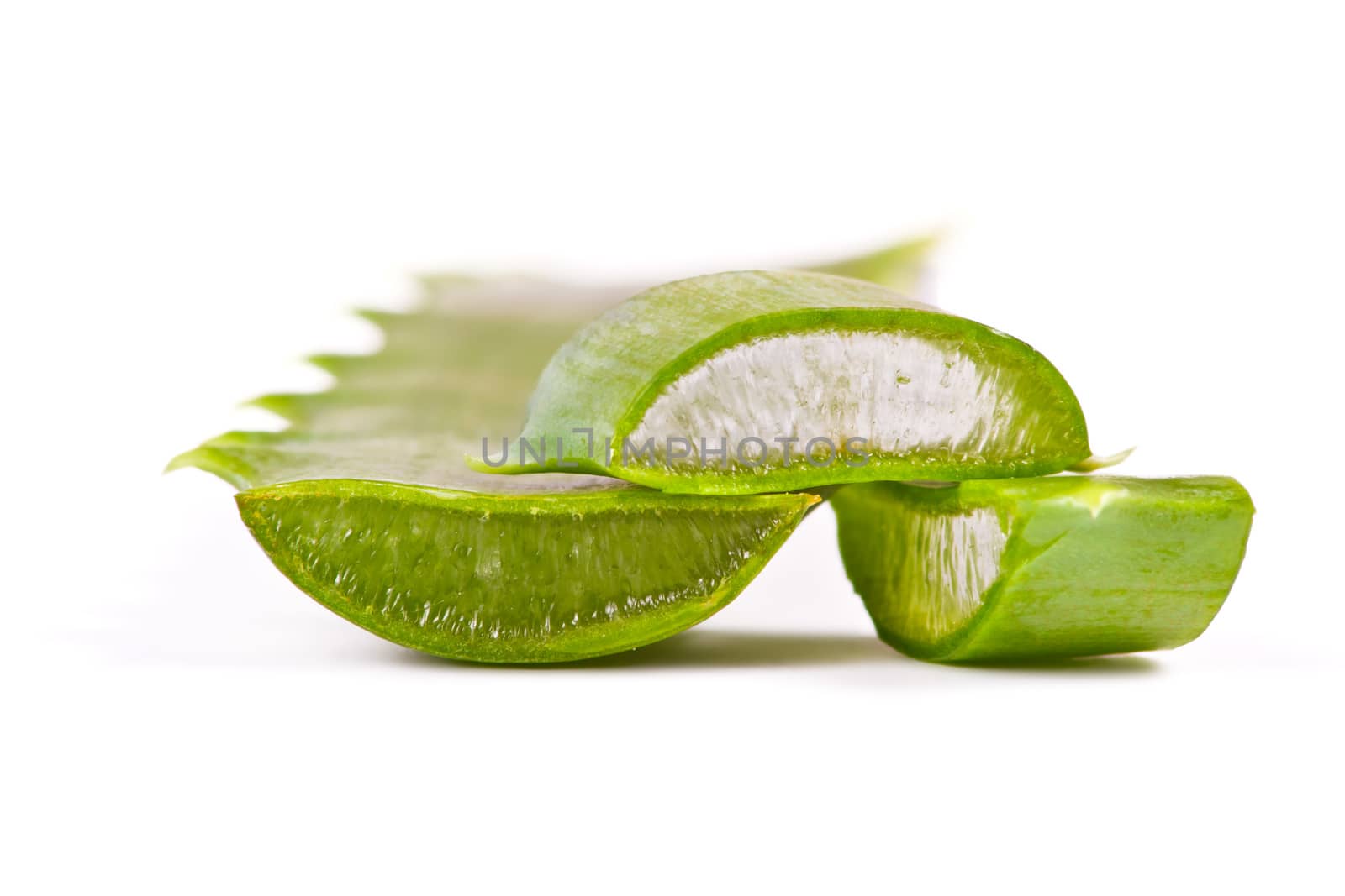 Juicy slices of aloe on white background