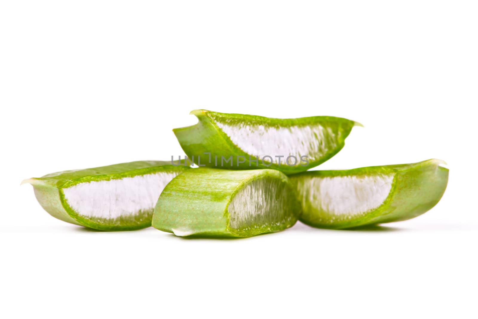 Juicy slices of aloe on white background