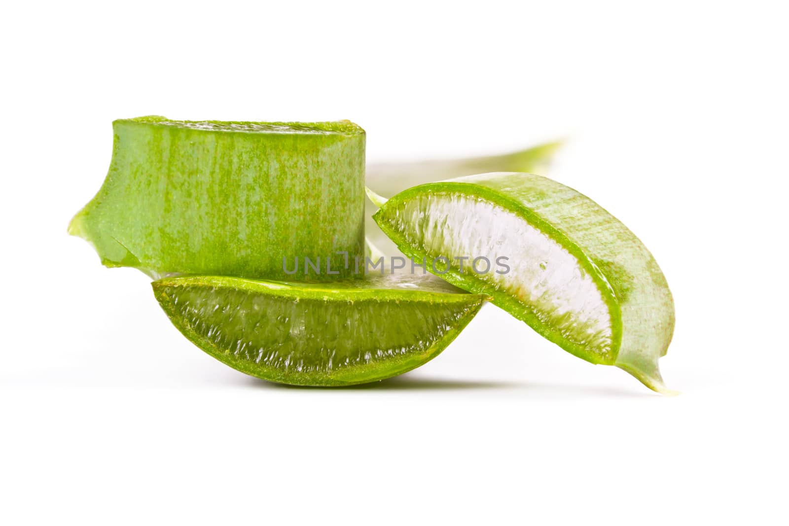 Juicy slices of aloe on white background