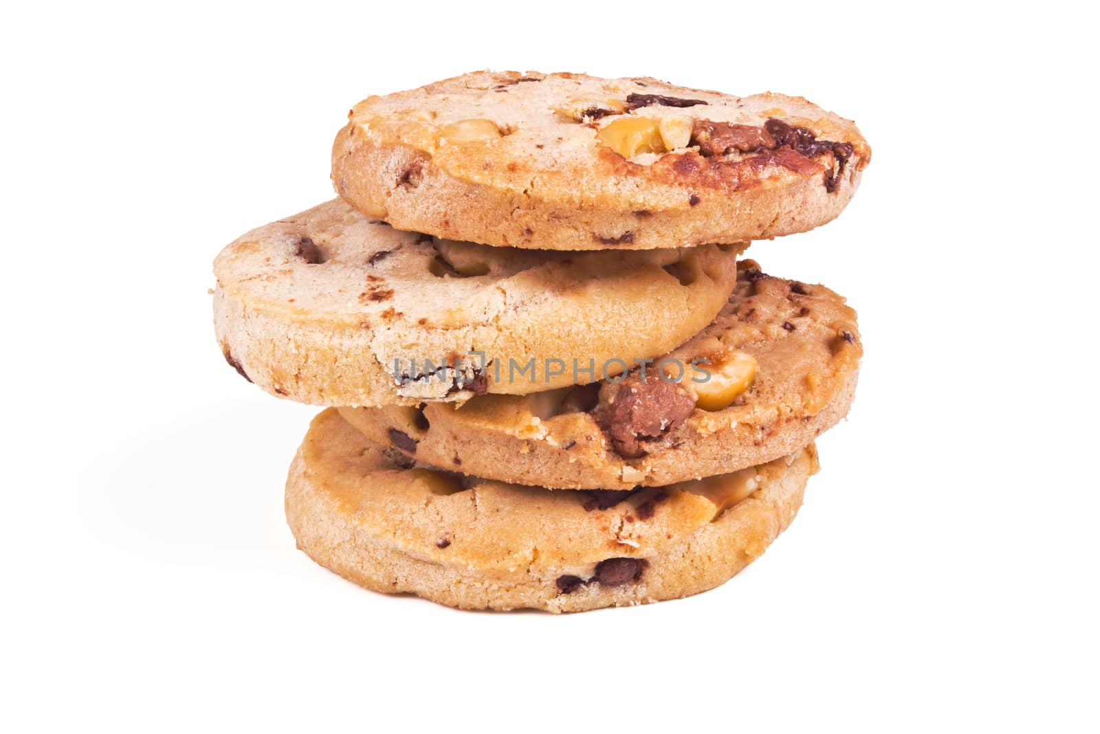 four round shortbread cookies with peanuts and chocolate on white background