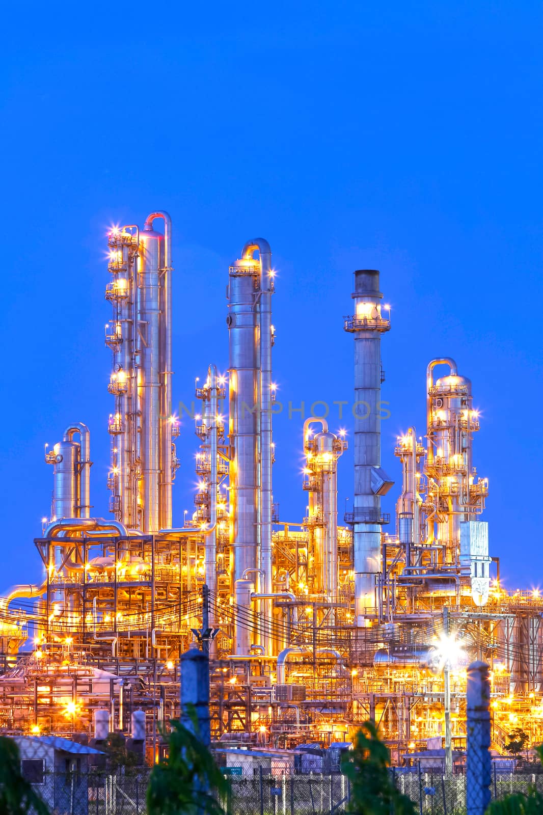 Lighting from structure of oil and chemical factory with blue sky background