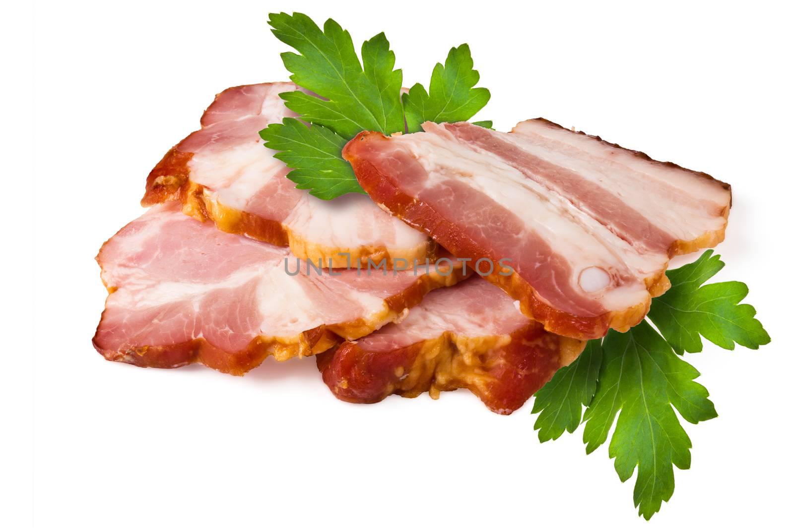 Smoked pork brisket and green leaves of parsley on a white background