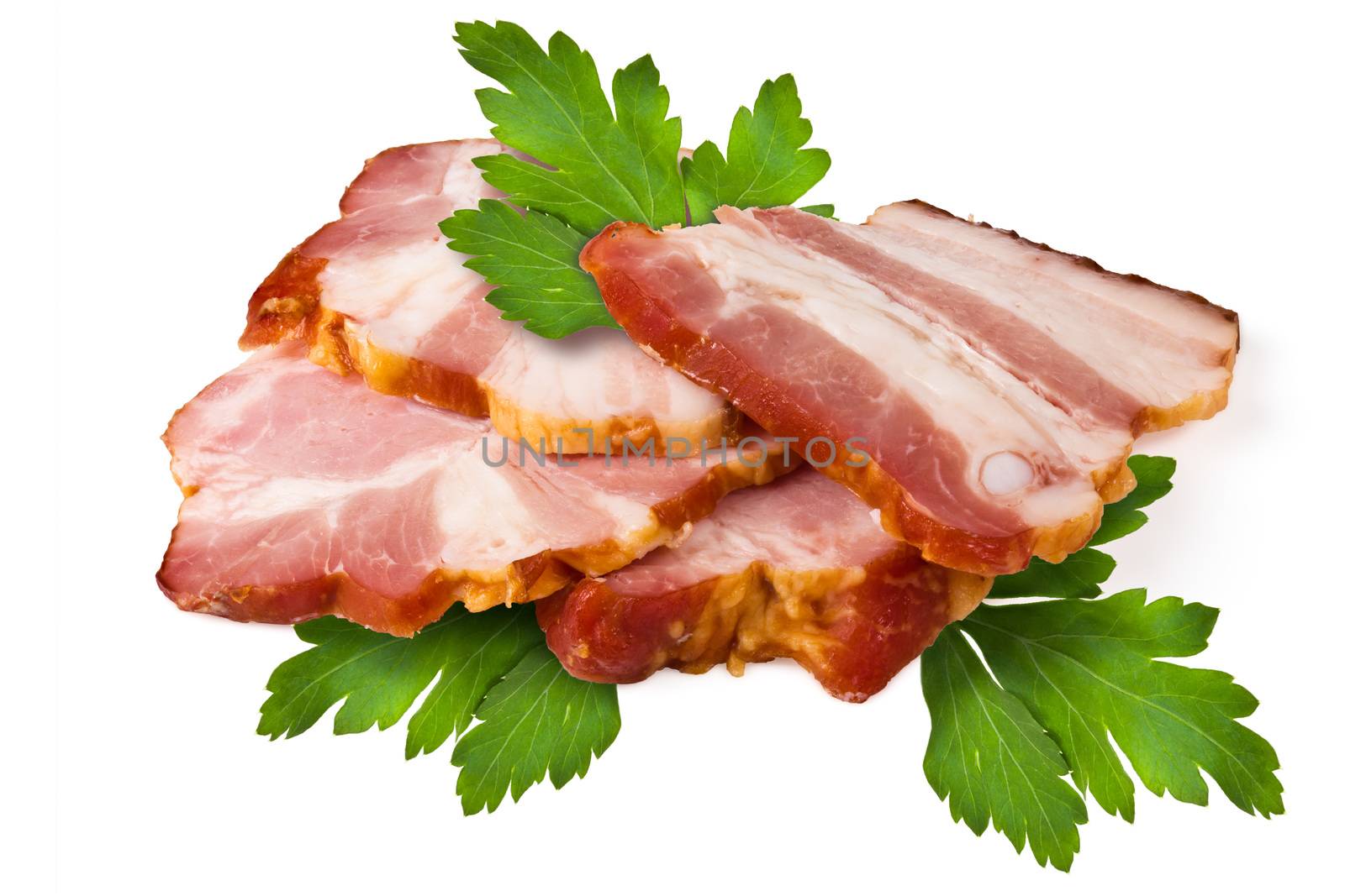 Smoked pork brisket and green leaves of parsley on a white background