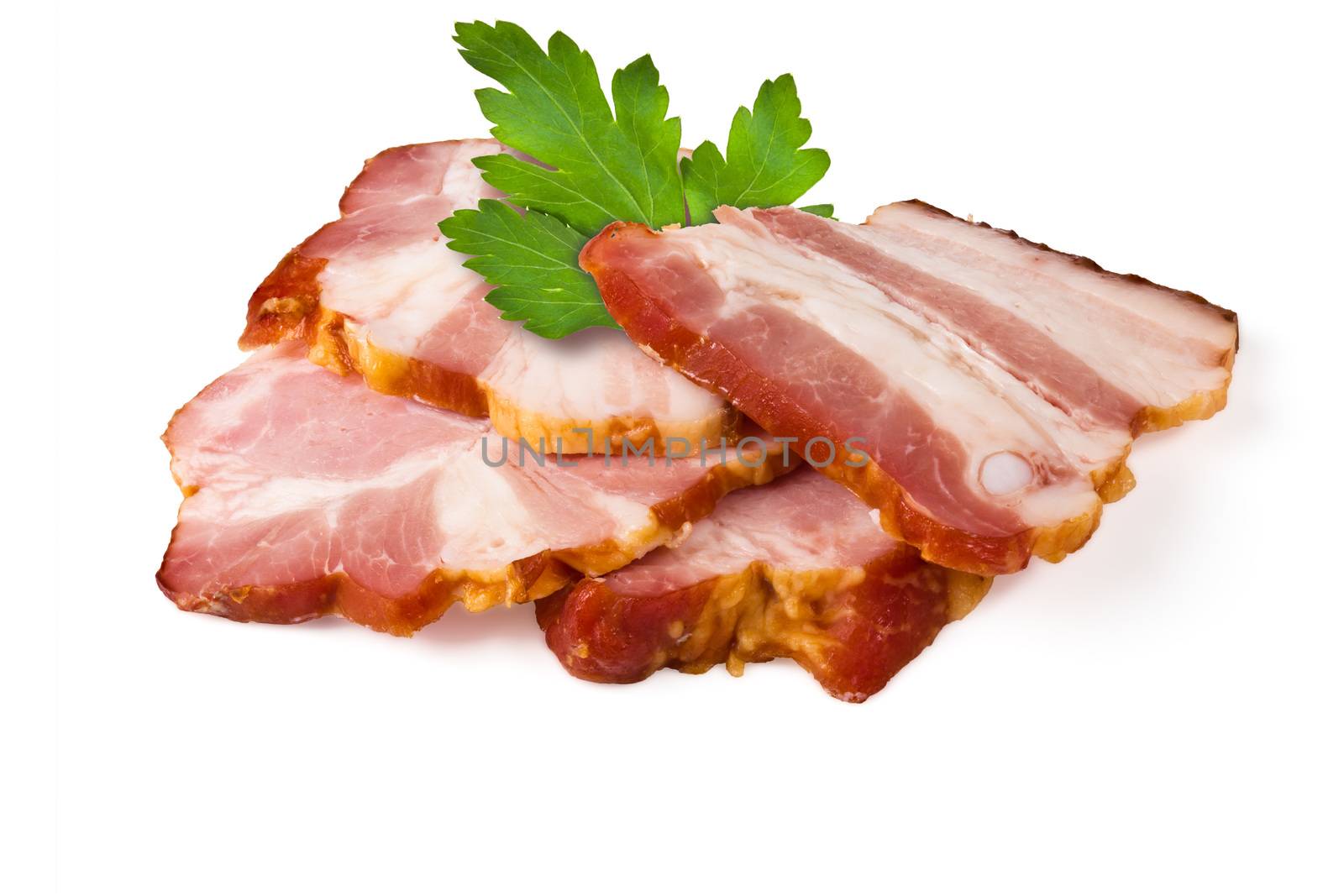 Smoked pork brisket and green leaves of parsley on a white background