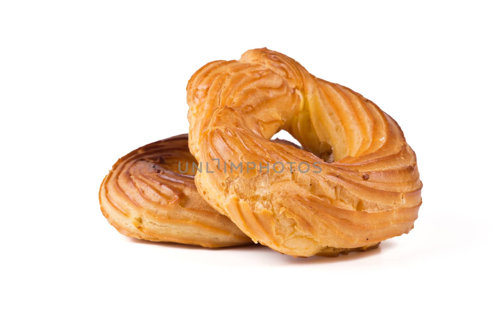 Fresh eclairs rings on a white background