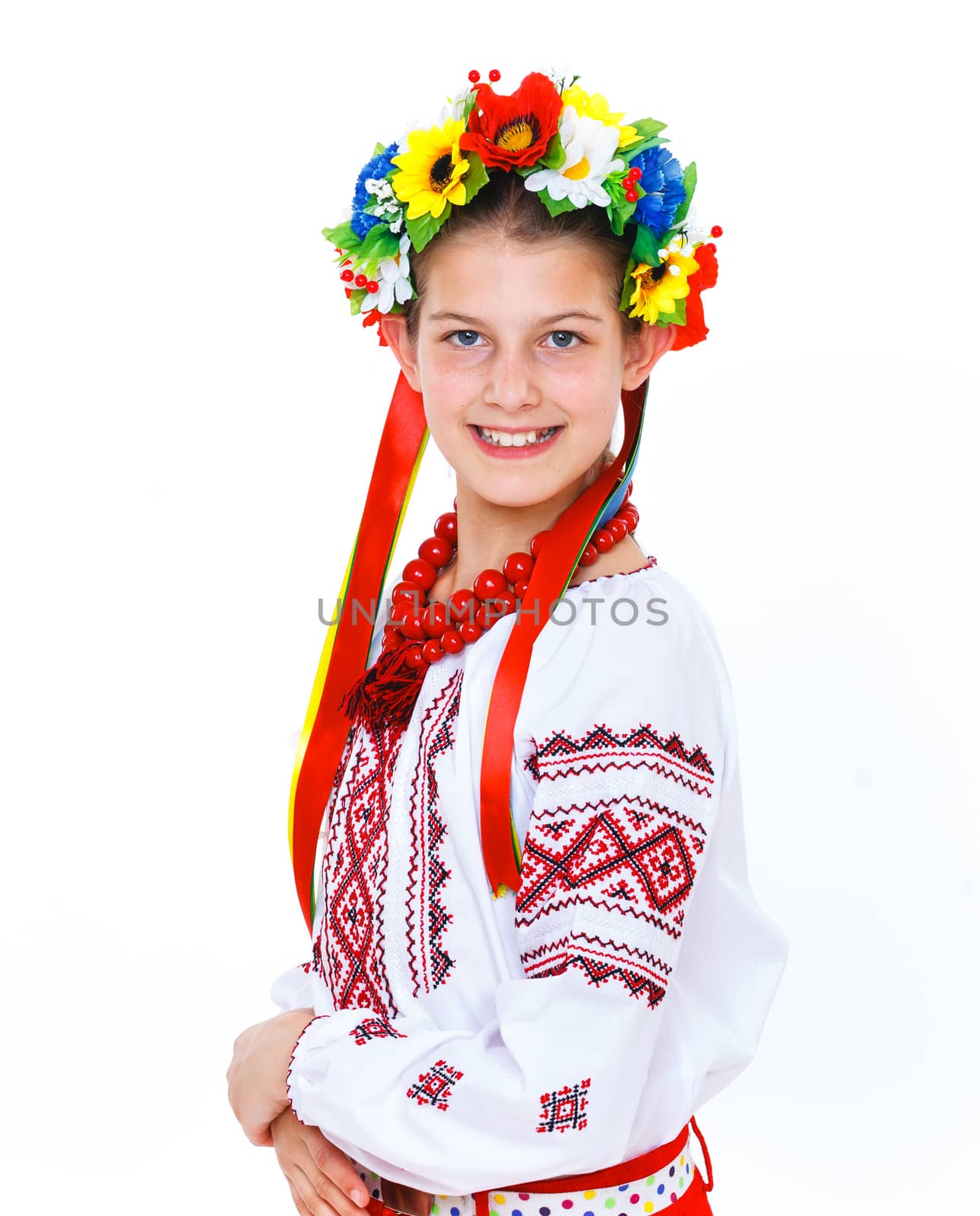 Portrait of happy cute girl in the Ukrainian national costume. Isolated white background