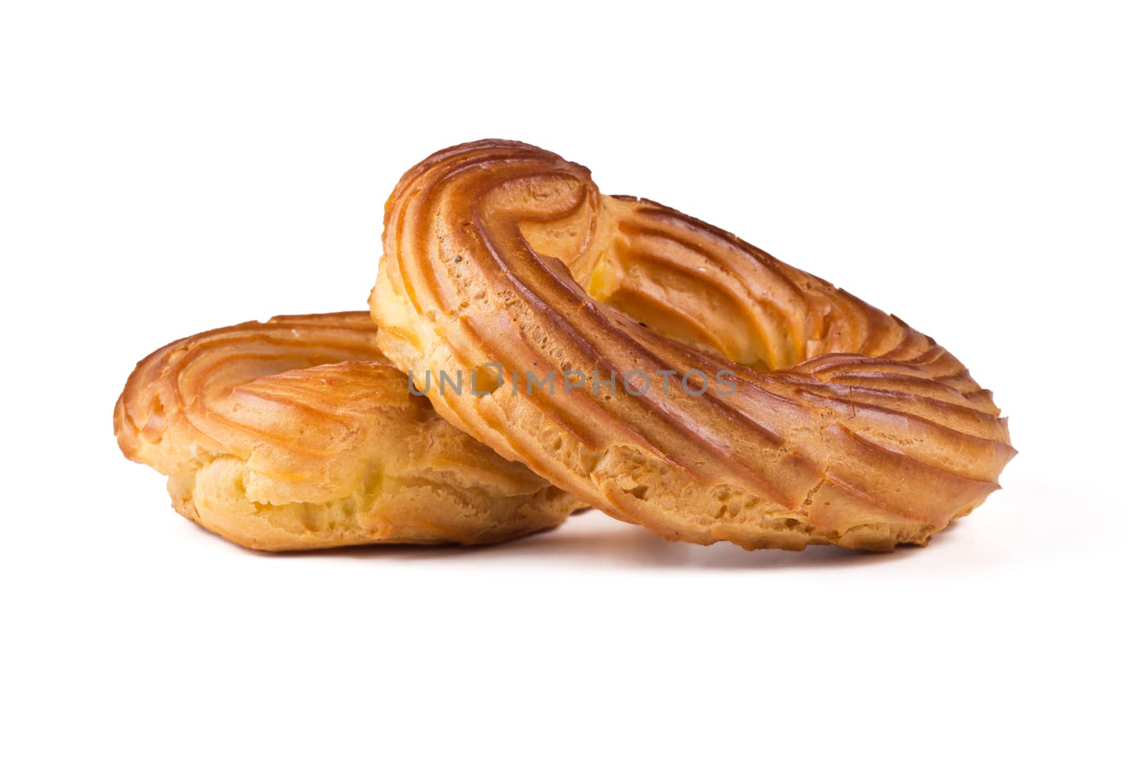 Fresh eclairs rings on a white background