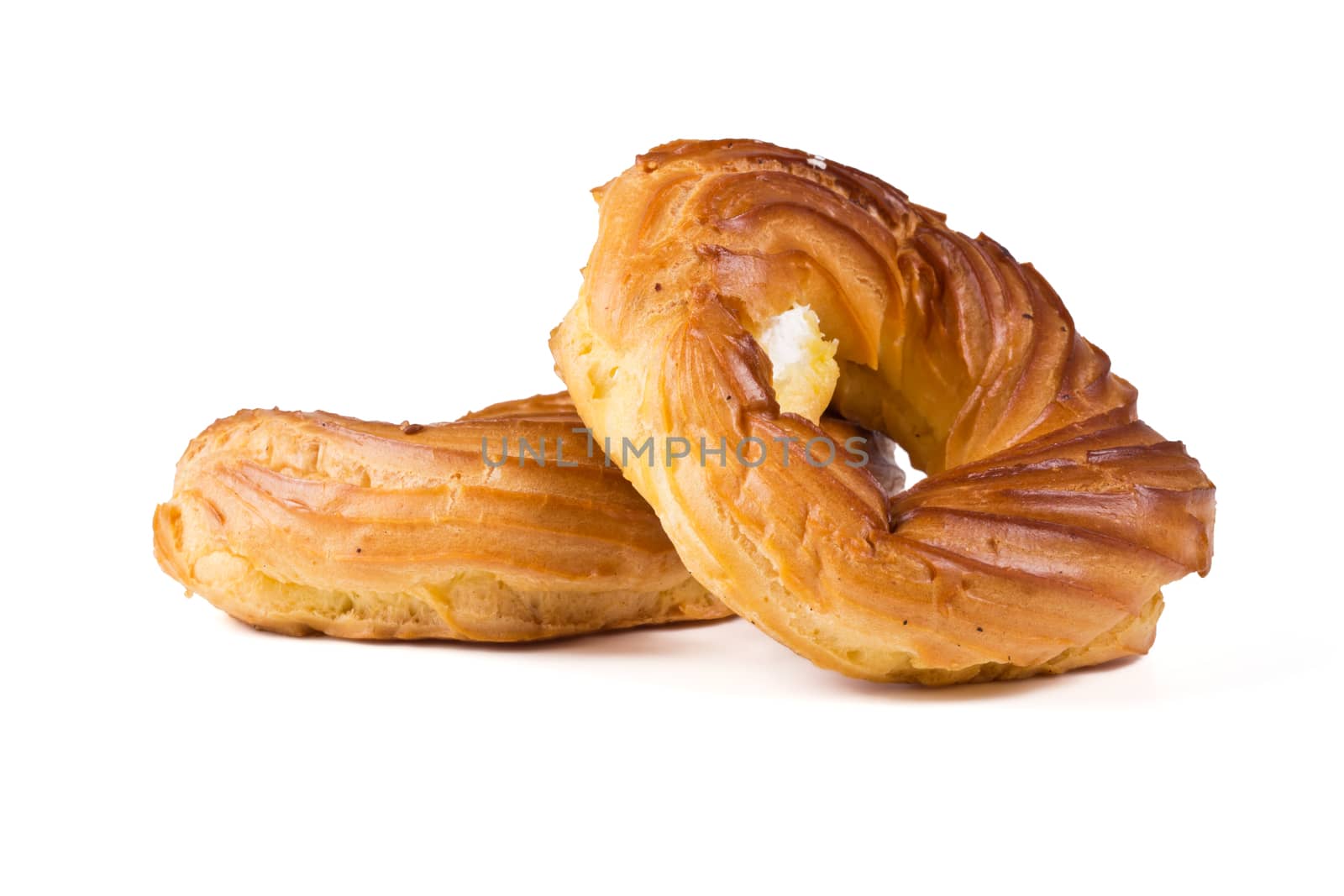 Fresh eclairs rings on a white background