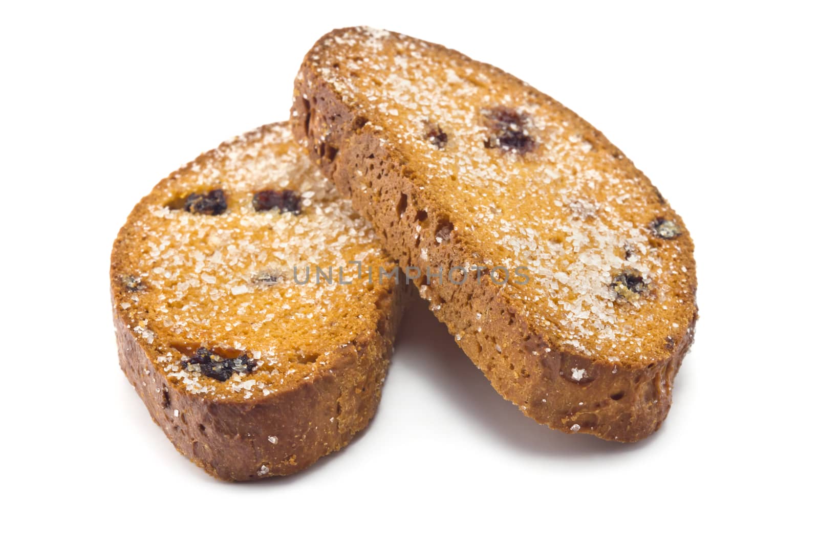 sweet rusks with raisins sprinkled with sugar on a white background