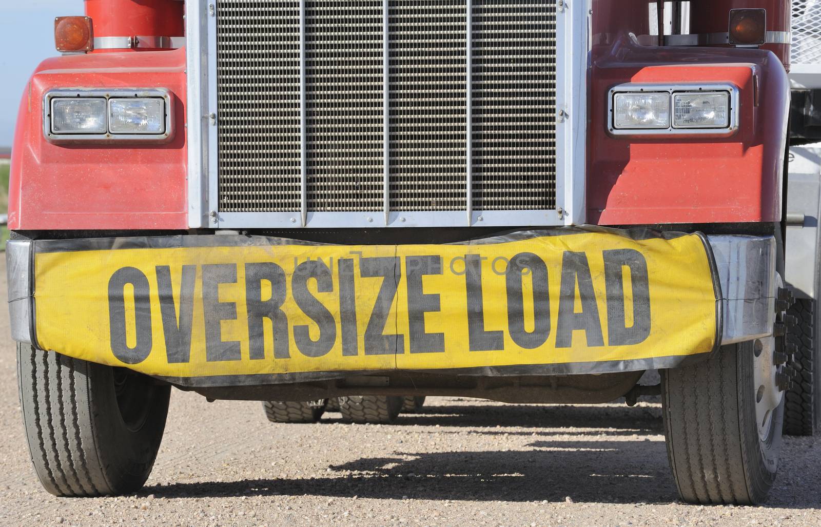 Closeup of oversize load sign on front of haulage truck
