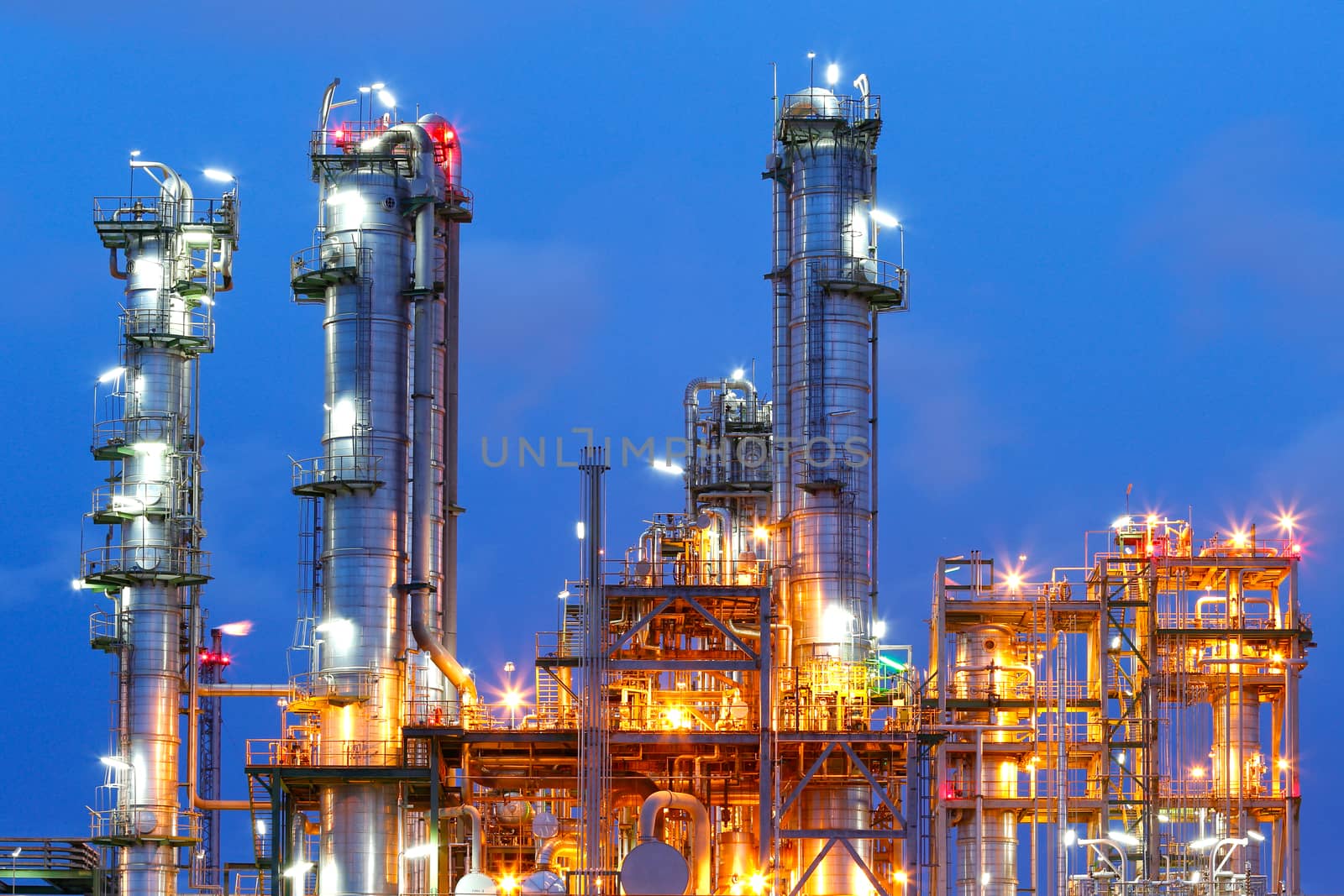 Lighting from structure of oil and chemical factory with blue sky background