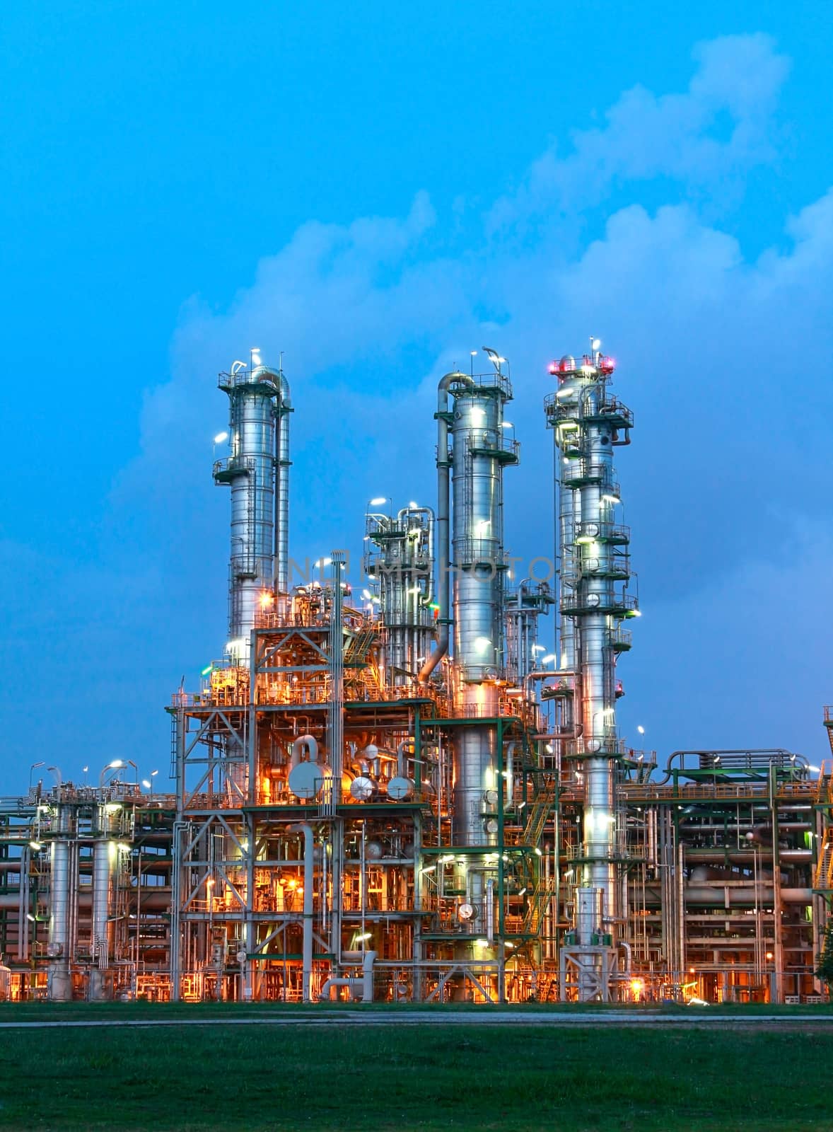 Lighting from structure of oil and chemical factory with blue sky background